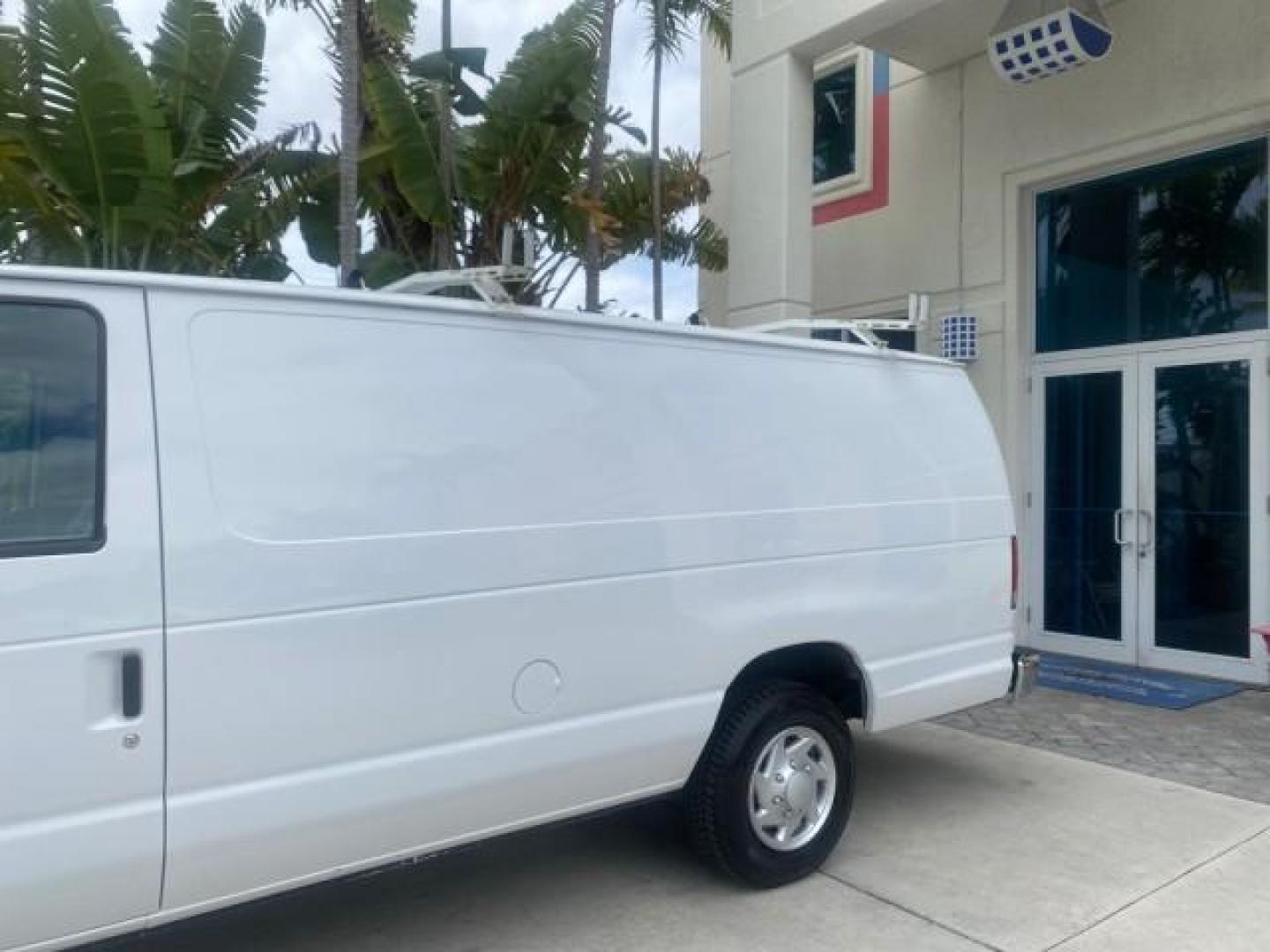 2014 Oxford White /Medium Flint Ford Econoline Cargo Van EXTENDED LOW MILES 6,380 1 OWNER (1FTNS1EW3ED) with an 4.6L EFI V8 FFV Capable Engine engine, Automatic transmission, located at 4701 North Dixie Hwy, Pompano Beach, FL, 33064, (954) 422-2889, 26.240938, -80.123474 - OUR WEBPAGE FLORIDACARS1.COM HAS OVER 100 PHOTOS AND FREE CARFAX LINK 2014 Ford E-Series E-150 1 OWNER Van 4.6L V8 F SOHC 16V Gasoline 16 MPG Rear Wheel Drive Features ABS Brakes Air Conditioning AM/FM Stereo Automatic Transmission Auxiliary Audio Input Barn Doors Power Locks Traction Control Vinyl - Photo#96