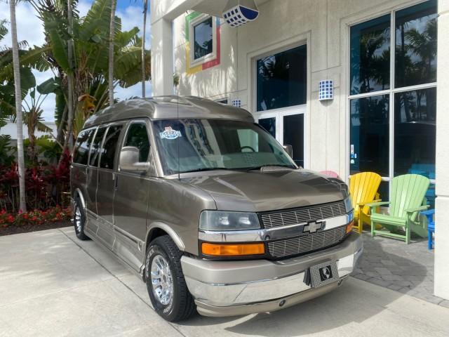 2004 Sandalwood Metallic /Neutral Chevrolet Express Passenger 1 OWNER HI TOP EXPLORER CONVERSION (1GBFG15T141) with an 5.3L Vortec 5300 V8 SFI Engine engine, Automatic transmission, located at 4701 North Dixie Hwy, Pompano Beach, FL, 33064, (954) 422-2889, 26.240938, -80.123474 - OUR WEBPAGE FLORIDACARS1.COM HAS OVER 100 PHOTOS AND FREE CARFAX LINK 2004 Chevrolet Express 1500 EXPLORER HIGH TOP CONVERSION TOP OF THE LINE LEATHER LOADED DUAL DOORS ON BOTH SIDES ONE OF A KIND FIND WILL NOT LAST IN STOCK Van 5.3L V8 F Gasoline 20 MPG Rear Wheel Drive Features ABS Brakes Air Cond - Photo#1