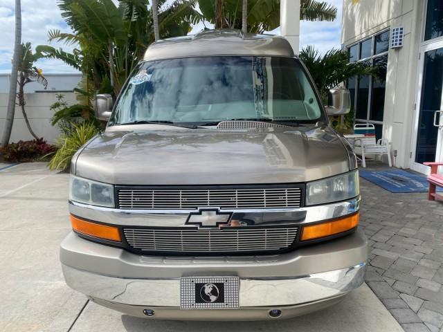 2004 Sandalwood Metallic /Neutral Chevrolet Express Passenger 1 OWNER HI TOP EXPLORER CONVERSION (1GBFG15T141) with an 5.3L Vortec 5300 V8 SFI Engine engine, Automatic transmission, located at 4701 North Dixie Hwy, Pompano Beach, FL, 33064, (954) 422-2889, 26.240938, -80.123474 - OUR WEBPAGE FLORIDACARS1.COM HAS OVER 100 PHOTOS AND FREE CARFAX LINK 2004 Chevrolet Express 1500 EXPLORER HIGH TOP CONVERSION TOP OF THE LINE LEATHER LOADED DUAL DOORS ON BOTH SIDES ONE OF A KIND FIND WILL NOT LAST IN STOCK Van 5.3L V8 F Gasoline 20 MPG Rear Wheel Drive Features ABS Brakes Air Cond - Photo#2