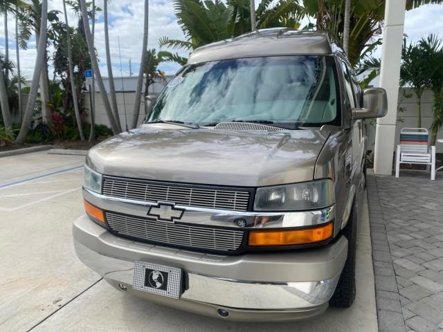 2004 Sandalwood Metallic /Neutral Chevrolet Express Passenger 1 OWNER HI TOP EXPLORER CONVERSION (1GBFG15T141) with an 5.3L Vortec 5300 V8 SFI Engine engine, Automatic transmission, located at 4701 North Dixie Hwy, Pompano Beach, FL, 33064, (954) 422-2889, 26.240938, -80.123474 - OUR WEBPAGE FLORIDACARS1.COM HAS OVER 100 PHOTOS AND FREE CARFAX LINK 2004 Chevrolet Express 1500 EXPLORER HIGH TOP CONVERSION TOP OF THE LINE LEATHER LOADED DUAL DOORS ON BOTH SIDES ONE OF A KIND FIND WILL NOT LAST IN STOCK Van 5.3L V8 F Gasoline 20 MPG Rear Wheel Drive Features ABS Brakes Air Cond - Photo#3