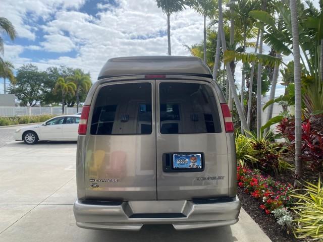 2004 Sandalwood Metallic /Neutral Chevrolet Express Passenger 1 OWNER HI TOP EXPLORER CONVERSION (1GBFG15T141) with an 5.3L Vortec 5300 V8 SFI Engine engine, Automatic transmission, located at 4701 North Dixie Hwy, Pompano Beach, FL, 33064, (954) 422-2889, 26.240938, -80.123474 - OUR WEBPAGE FLORIDACARS1.COM HAS OVER 100 PHOTOS AND FREE CARFAX LINK 2004 Chevrolet Express 1500 EXPLORER HIGH TOP CONVERSION TOP OF THE LINE LEATHER LOADED DUAL DOORS ON BOTH SIDES ONE OF A KIND FIND WILL NOT LAST IN STOCK Van 5.3L V8 F Gasoline 20 MPG Rear Wheel Drive Features ABS Brakes Air Cond - Photo#6