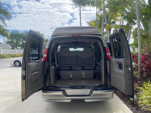 2004 Sandalwood Metallic /Neutral Chevrolet Express Passenger 1 OWNER HI TOP EXPLORER CONVERSION (1GBFG15T141) with an 5.3L Vortec 5300 V8 SFI Engine engine, Automatic transmission, located at 4701 North Dixie Hwy, Pompano Beach, FL, 33064, (954) 422-2889, 26.240938, -80.123474 - OUR WEBPAGE FLORIDACARS1.COM HAS OVER 100 PHOTOS AND FREE CARFAX LINK 2004 Chevrolet Express 1500 EXPLORER HIGH TOP CONVERSION TOP OF THE LINE LEATHER LOADED DUAL DOORS ON BOTH SIDES ONE OF A KIND FIND WILL NOT LAST IN STOCK Van 5.3L V8 F Gasoline 20 MPG Rear Wheel Drive Features ABS Brakes Air Cond - Photo#15