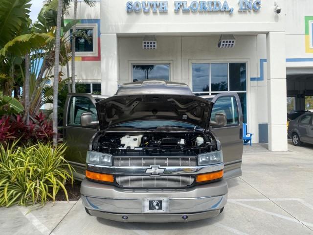 2004 Sandalwood Metallic /Neutral Chevrolet Express Passenger 1 OWNER HI TOP EXPLORER CONVERSION (1GBFG15T141) with an 5.3L Vortec 5300 V8 SFI Engine engine, Automatic transmission, located at 4701 North Dixie Hwy, Pompano Beach, FL, 33064, (954) 422-2889, 26.240938, -80.123474 - OUR WEBPAGE FLORIDACARS1.COM HAS OVER 100 PHOTOS AND FREE CARFAX LINK 2004 Chevrolet Express 1500 EXPLORER HIGH TOP CONVERSION TOP OF THE LINE LEATHER LOADED DUAL DOORS ON BOTH SIDES ONE OF A KIND FIND WILL NOT LAST IN STOCK Van 5.3L V8 F Gasoline 20 MPG Rear Wheel Drive Features ABS Brakes Air Cond - Photo#16
