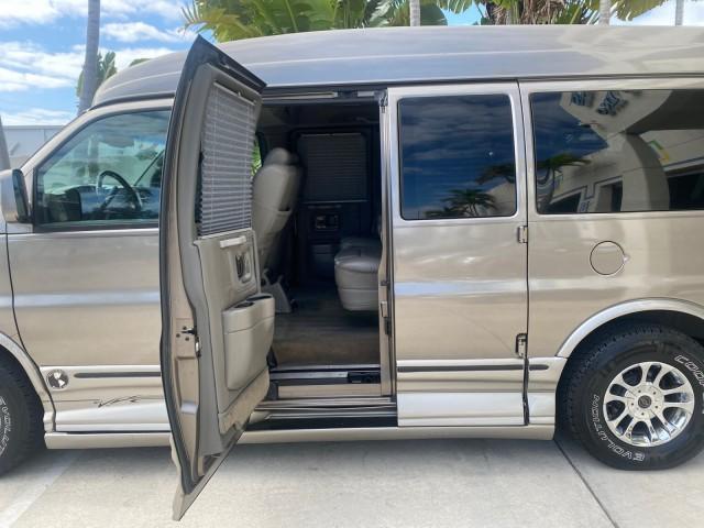 2004 Sandalwood Metallic /Neutral Chevrolet Express Passenger 1 OWNER HI TOP EXPLORER CONVERSION (1GBFG15T141) with an 5.3L Vortec 5300 V8 SFI Engine engine, Automatic transmission, located at 4701 North Dixie Hwy, Pompano Beach, FL, 33064, (954) 422-2889, 26.240938, -80.123474 - OUR WEBPAGE FLORIDACARS1.COM HAS OVER 100 PHOTOS AND FREE CARFAX LINK 2004 Chevrolet Express 1500 EXPLORER HIGH TOP CONVERSION TOP OF THE LINE LEATHER LOADED DUAL DOORS ON BOTH SIDES ONE OF A KIND FIND WILL NOT LAST IN STOCK Van 5.3L V8 F Gasoline 20 MPG Rear Wheel Drive Features ABS Brakes Air Cond - Photo#73