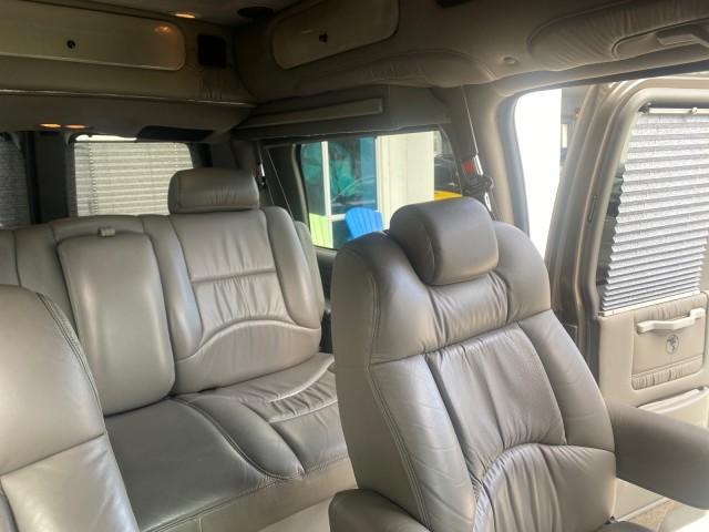 2004 Sandalwood Metallic /Neutral Chevrolet Express Passenger 1 OWNER HI TOP EXPLORER CONVERSION (1GBFG15T141) with an 5.3L Vortec 5300 V8 SFI Engine engine, Automatic transmission, located at 4701 North Dixie Hwy, Pompano Beach, FL, 33064, (954) 422-2889, 26.240938, -80.123474 - OUR WEBPAGE FLORIDACARS1.COM HAS OVER 100 PHOTOS AND FREE CARFAX LINK 2004 Chevrolet Express 1500 EXPLORER HIGH TOP CONVERSION TOP OF THE LINE LEATHER LOADED DUAL DOORS ON BOTH SIDES ONE OF A KIND FIND WILL NOT LAST IN STOCK Van 5.3L V8 F Gasoline 20 MPG Rear Wheel Drive Features ABS Brakes Air Cond - Photo#90