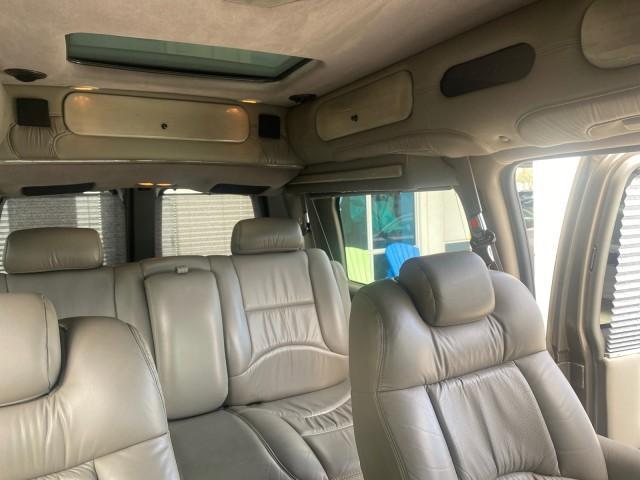 2004 Sandalwood Metallic /Neutral Chevrolet Express Passenger 1 OWNER HI TOP EXPLORER CONVERSION (1GBFG15T141) with an 5.3L Vortec 5300 V8 SFI Engine engine, Automatic transmission, located at 4701 North Dixie Hwy, Pompano Beach, FL, 33064, (954) 422-2889, 26.240938, -80.123474 - OUR WEBPAGE FLORIDACARS1.COM HAS OVER 100 PHOTOS AND FREE CARFAX LINK 2004 Chevrolet Express 1500 EXPLORER HIGH TOP CONVERSION TOP OF THE LINE LEATHER LOADED DUAL DOORS ON BOTH SIDES ONE OF A KIND FIND WILL NOT LAST IN STOCK Van 5.3L V8 F Gasoline 20 MPG Rear Wheel Drive Features ABS Brakes Air Cond - Photo#91