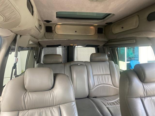 2004 Sandalwood Metallic /Neutral Chevrolet Express Passenger 1 OWNER HI TOP EXPLORER CONVERSION (1GBFG15T141) with an 5.3L Vortec 5300 V8 SFI Engine engine, Automatic transmission, located at 4701 North Dixie Hwy, Pompano Beach, FL, 33064, (954) 422-2889, 26.240938, -80.123474 - OUR WEBPAGE FLORIDACARS1.COM HAS OVER 100 PHOTOS AND FREE CARFAX LINK 2004 Chevrolet Express 1500 EXPLORER HIGH TOP CONVERSION TOP OF THE LINE LEATHER LOADED DUAL DOORS ON BOTH SIDES ONE OF A KIND FIND WILL NOT LAST IN STOCK Van 5.3L V8 F Gasoline 20 MPG Rear Wheel Drive Features ABS Brakes Air Cond - Photo#92