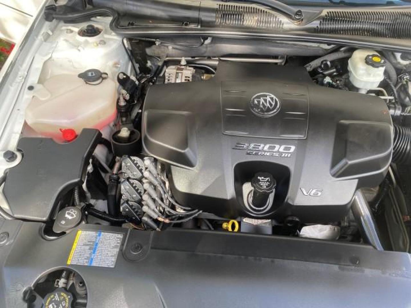 2008 White Opal /Cocoa/Cashmere Buick Lucerne CXL LOW MILES 40,989 1 OWNER (1G4HD57298U) with an 3.8L V6 SFI Engine engine, Automatic transmission, located at 4701 North Dixie Hwy, Pompano Beach, FL, 33064, (954) 422-2889, 26.240938, -80.123474 - OUR WEBPAGE FLORIDACARS1.COM HAS OVER 100 PHOTOS AND FREE CARFAX LINK 2008 Buick Lucerne CXL 1 OWNER CARFAX MINOR BUMPER SCUFF AUTO CHECK 1 OWNER NO ACCIDENTS Sedan 4 DR 3.8L V6 F Gasoline 28 MPG Front Wheel Drive Features ABS Brakes Air Conditioning Alloy Wheels AM/FM Stereo Automatic Transmission- Photo#24