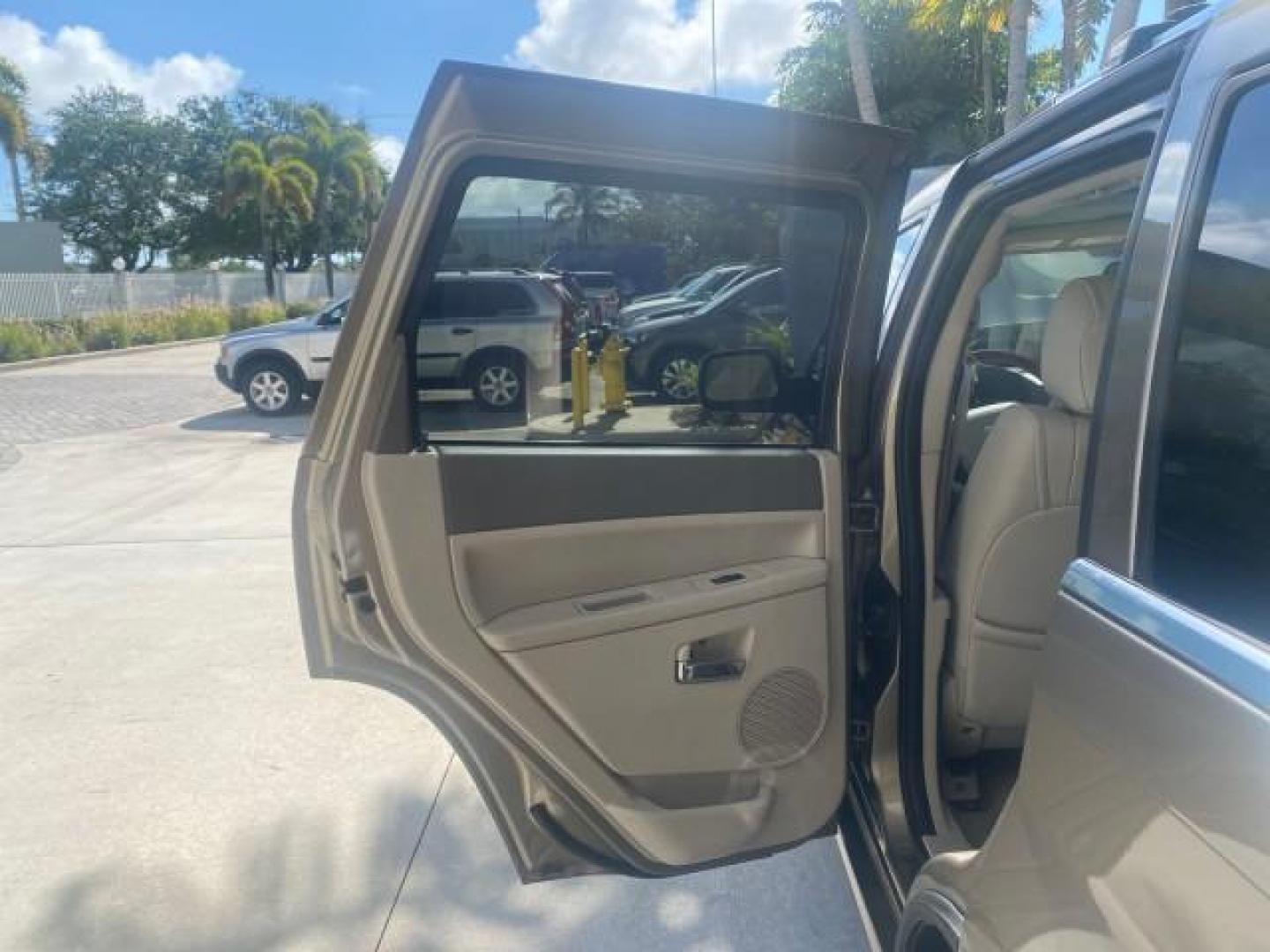 2006 Dark Khaki Pearl /Dark Khaki/Lght Graystone Jeep Grand Cherokee Overland LOW MILES 57,372 1 OWNER 4WD (1J8HR68226C) with an 5.7L Hemi Multi Displacement Engine engine, Automatic transmission, located at 4701 North Dixie Hwy, Pompano Beach, FL, 33064, (954) 422-2889, 26.240938, -80.123474 - OUR WEBPAGE FLORIDACARS1.COM HAS OVER 100 PHOTOS AND FREE CARFAX LINK 2006 Jeep Grand Cherokee Overland 1 OWNER 4WD 4 Door Wagon/Sport Utility 5.7L V8 F Gasoline 19 MPG Rear Wheel Drive w/ 4X4 Features 4WD/AWD ABS Brakes Air Conditioning Alloy Wheels AM/FM Stereo Automatic Transmission Auxiliary Aud- Photo#13