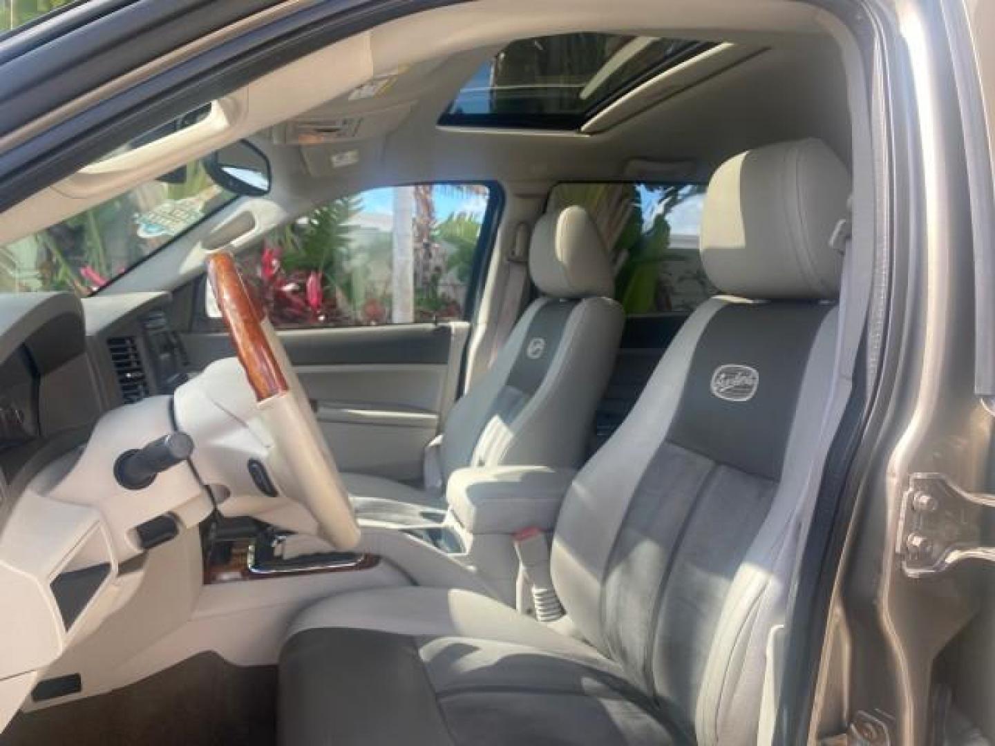 2006 Dark Khaki Pearl /Dark Khaki/Lght Graystone Jeep Grand Cherokee Overland LOW MILES 57,372 1 OWNER 4WD (1J8HR68226C) with an 5.7L Hemi Multi Displacement Engine engine, Automatic transmission, located at 4701 North Dixie Hwy, Pompano Beach, FL, 33064, (954) 422-2889, 26.240938, -80.123474 - OUR WEBPAGE FLORIDACARS1.COM HAS OVER 100 PHOTOS AND FREE CARFAX LINK 2006 Jeep Grand Cherokee Overland 1 OWNER 4WD 4 Door Wagon/Sport Utility 5.7L V8 F Gasoline 19 MPG Rear Wheel Drive w/ 4X4 Features 4WD/AWD ABS Brakes Air Conditioning Alloy Wheels AM/FM Stereo Automatic Transmission Auxiliary Aud- Photo#44