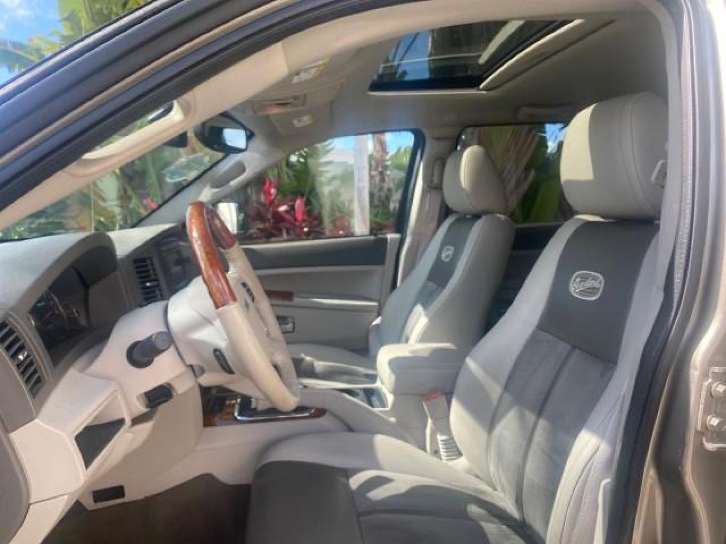 2006 Dark Khaki Pearl /Dark Khaki/Lght Graystone Jeep Grand Cherokee Overland LOW MILES 57,372 1 OWNER 4WD (1J8HR68226C) with an 5.7L Hemi Multi Displacement Engine engine, Automatic transmission, located at 4701 North Dixie Hwy, Pompano Beach, FL, 33064, (954) 422-2889, 26.240938, -80.123474 - OUR WEBPAGE FLORIDACARS1.COM HAS OVER 100 PHOTOS AND FREE CARFAX LINK 2006 Jeep Grand Cherokee Overland 1 OWNER 4WD 4 Door Wagon/Sport Utility 5.7L V8 F Gasoline 19 MPG Rear Wheel Drive w/ 4X4 Features 4WD/AWD ABS Brakes Air Conditioning Alloy Wheels AM/FM Stereo Automatic Transmission Auxiliary Aud- Photo#45