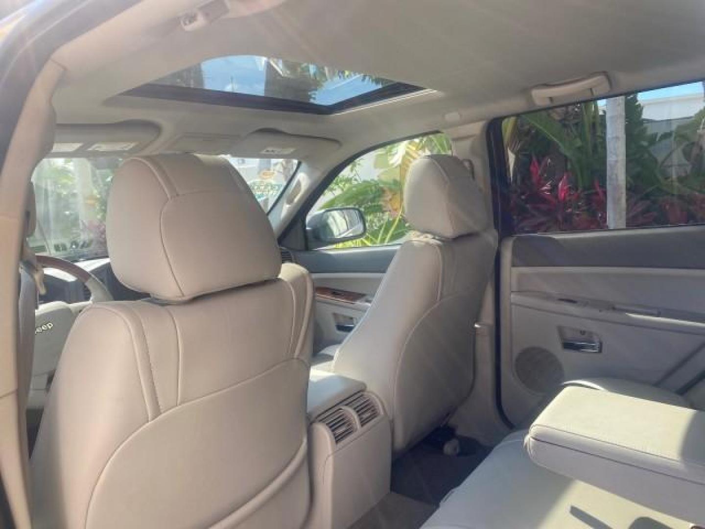 2006 Dark Khaki Pearl /Dark Khaki/Lght Graystone Jeep Grand Cherokee Overland LOW MILES 57,372 1 OWNER 4WD (1J8HR68226C) with an 5.7L Hemi Multi Displacement Engine engine, Automatic transmission, located at 4701 North Dixie Hwy, Pompano Beach, FL, 33064, (954) 422-2889, 26.240938, -80.123474 - OUR WEBPAGE FLORIDACARS1.COM HAS OVER 100 PHOTOS AND FREE CARFAX LINK 2006 Jeep Grand Cherokee Overland 1 OWNER 4WD 4 Door Wagon/Sport Utility 5.7L V8 F Gasoline 19 MPG Rear Wheel Drive w/ 4X4 Features 4WD/AWD ABS Brakes Air Conditioning Alloy Wheels AM/FM Stereo Automatic Transmission Auxiliary Aud- Photo#83