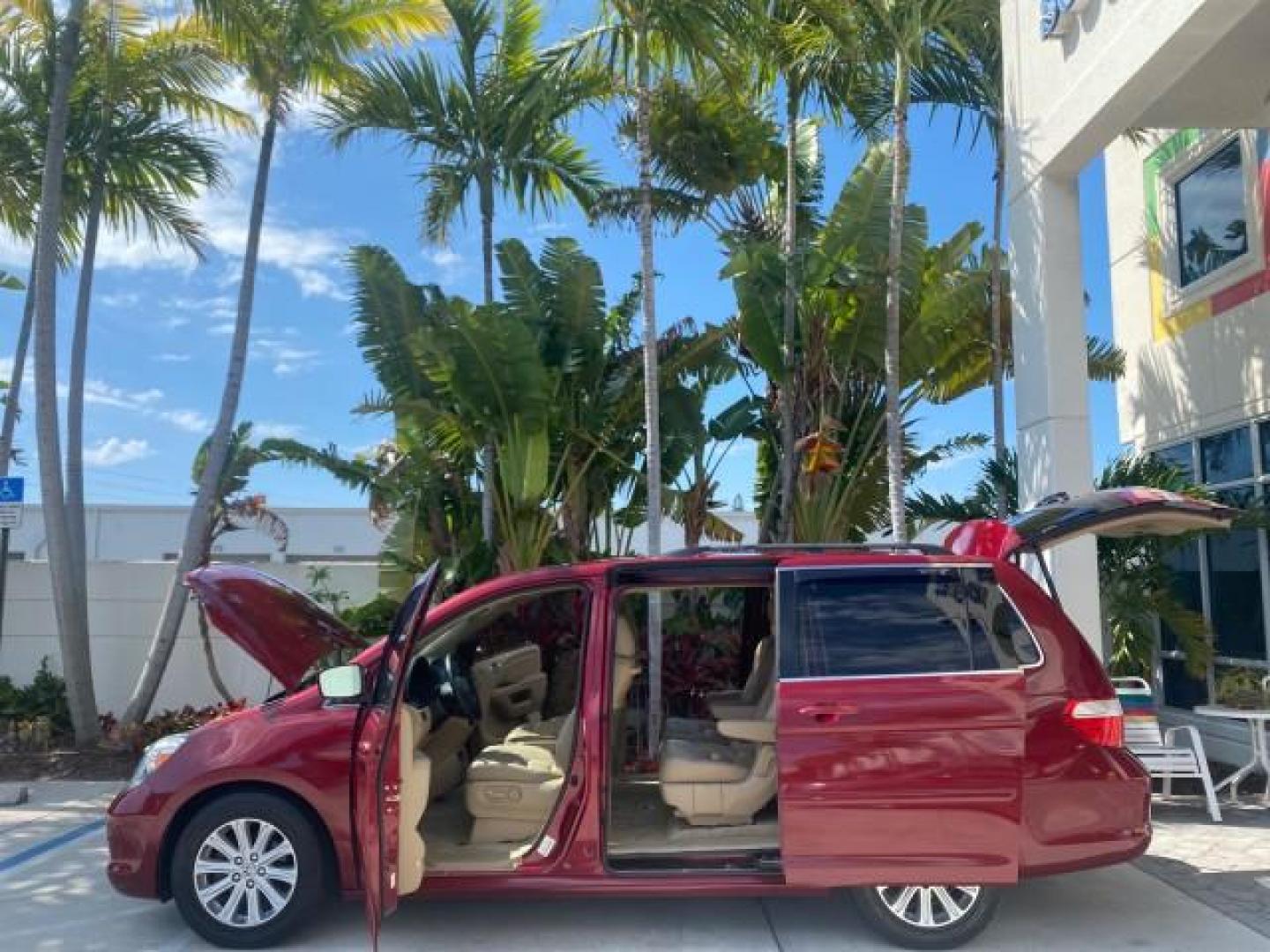 2005 Redrock Pearl /Ivory Honda Odyssey TOURING LOW MILES 62,337 FL (5FNRL38815B) with an 3.5L SOHC MPFI 24-Valve i-VTEC V6 Engine engine, Automatic transmission, located at 4701 North Dixie Hwy, Pompano Beach, FL, 33064, (954) 422-2889, 26.240938, -80.123474 - OUR WEBPAGE FLORIDACARS1.COM HAS OVER 100 PHOTOS AND FREE CARFAX LINK 2005 Honda Odyssey Touring LOADED LEATHER SUNROOF NAVIGATION Van 3.5L V6 F SOHC 24V Gasoline 28 MPG Front Wheel Drive Features ABS Brakes Air Conditioning Alloy Wheels AM/FM Stereo Automatic Transmission Auxiliary Audio Input CD A- Photo#8