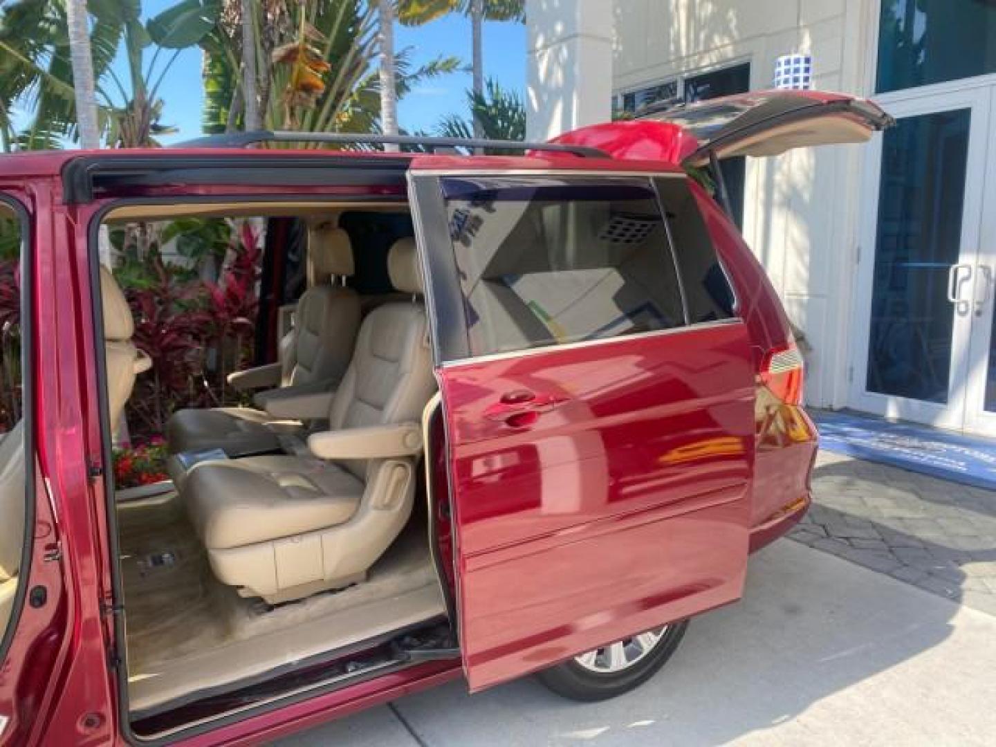 2005 Redrock Pearl /Ivory Honda Odyssey TOURING LOW MILES 62,337 FL (5FNRL38815B) with an 3.5L SOHC MPFI 24-Valve i-VTEC V6 Engine engine, Automatic transmission, located at 4701 North Dixie Hwy, Pompano Beach, FL, 33064, (954) 422-2889, 26.240938, -80.123474 - OUR WEBPAGE FLORIDACARS1.COM HAS OVER 100 PHOTOS AND FREE CARFAX LINK 2005 Honda Odyssey Touring LOADED LEATHER SUNROOF NAVIGATION Van 3.5L V6 F SOHC 24V Gasoline 28 MPG Front Wheel Drive Features ABS Brakes Air Conditioning Alloy Wheels AM/FM Stereo Automatic Transmission Auxiliary Audio Input CD A- Photo#13