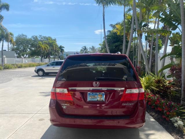 2005 Redrock Pearl /Ivory Honda Odyssey TOURING LOW MILES 62,337 FL (5FNRL38815B) with an 3.5L SOHC MPFI 24-Valve i-VTEC V6 Engine engine, Automatic transmission, located at 4701 North Dixie Hwy, Pompano Beach, FL, 33064, (954) 422-2889, 26.240938, -80.123474 - OUR WEBPAGE FLORIDACARS1.COM HAS OVER 100 PHOTOS AND FREE CARFAX LINK 2005 Honda Odyssey Touring LOADED LEATHER SUNROOF NAVIGATION Van 3.5L V6 F SOHC 24V Gasoline 28 MPG Front Wheel Drive Features ABS Brakes Air Conditioning Alloy Wheels AM/FM Stereo Automatic Transmission Auxiliary Audio Input CD A - Photo#32
