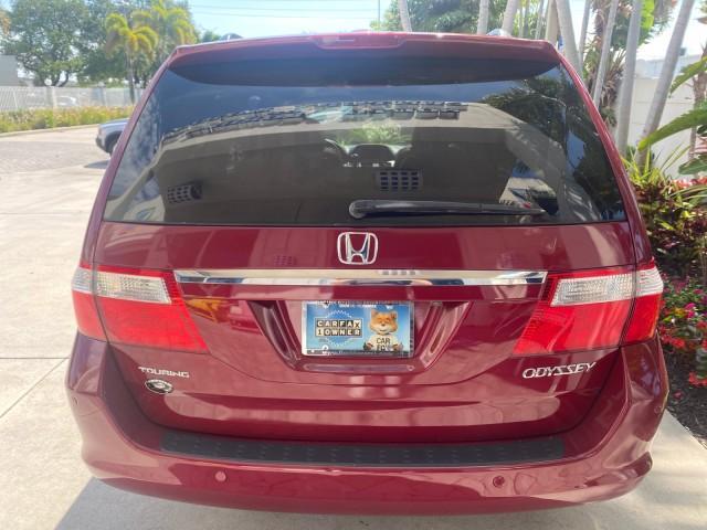 2005 Redrock Pearl /Ivory Honda Odyssey TOURING LOW MILES 62,337 FL (5FNRL38815B) with an 3.5L SOHC MPFI 24-Valve i-VTEC V6 Engine engine, Automatic transmission, located at 4701 North Dixie Hwy, Pompano Beach, FL, 33064, (954) 422-2889, 26.240938, -80.123474 - OUR WEBPAGE FLORIDACARS1.COM HAS OVER 100 PHOTOS AND FREE CARFAX LINK 2005 Honda Odyssey Touring LOADED LEATHER SUNROOF NAVIGATION Van 3.5L V6 F SOHC 24V Gasoline 28 MPG Front Wheel Drive Features ABS Brakes Air Conditioning Alloy Wheels AM/FM Stereo Automatic Transmission Auxiliary Audio Input CD A - Photo#33