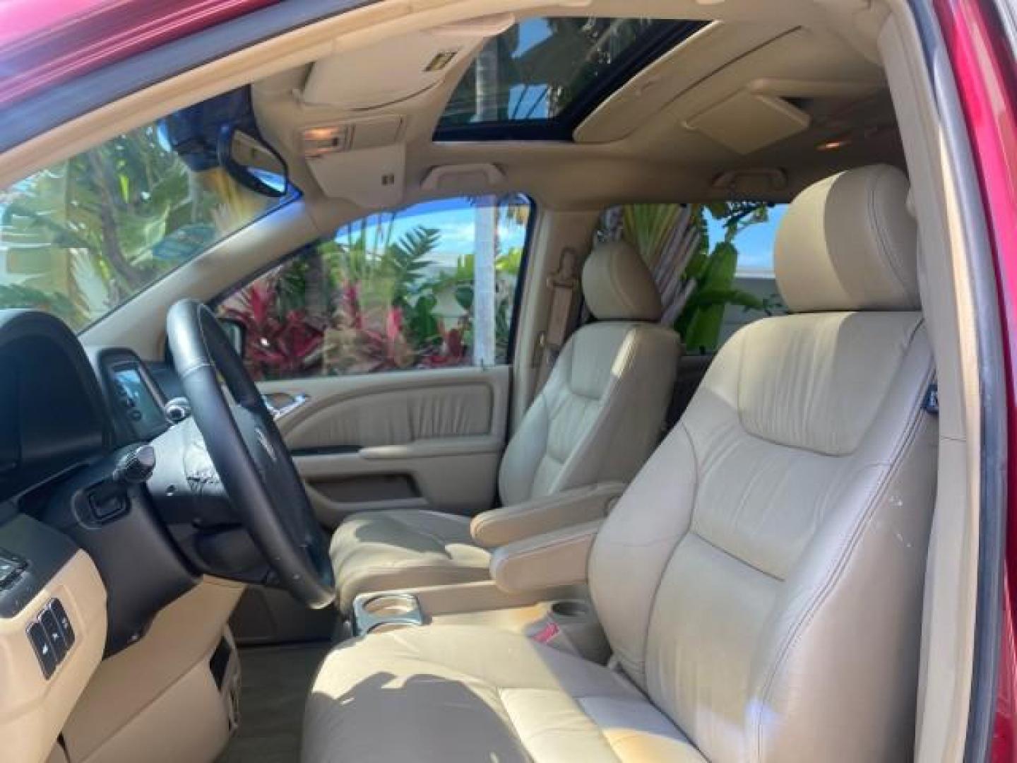 2005 Redrock Pearl /Ivory Honda Odyssey TOURING LOW MILES 62,337 FL (5FNRL38815B) with an 3.5L SOHC MPFI 24-Valve i-VTEC V6 Engine engine, Automatic transmission, located at 4701 North Dixie Hwy, Pompano Beach, FL, 33064, (954) 422-2889, 26.240938, -80.123474 - OUR WEBPAGE FLORIDACARS1.COM HAS OVER 100 PHOTOS AND FREE CARFAX LINK 2005 Honda Odyssey Touring LOADED LEATHER SUNROOF NAVIGATION Van 3.5L V6 F SOHC 24V Gasoline 28 MPG Front Wheel Drive Features ABS Brakes Air Conditioning Alloy Wheels AM/FM Stereo Automatic Transmission Auxiliary Audio Input CD A- Photo#40