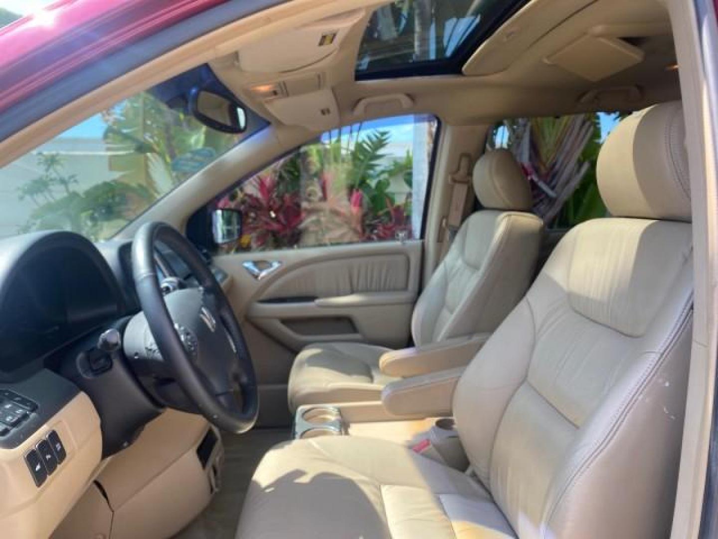 2005 Redrock Pearl /Ivory Honda Odyssey TOURING LOW MILES 62,337 FL (5FNRL38815B) with an 3.5L SOHC MPFI 24-Valve i-VTEC V6 Engine engine, Automatic transmission, located at 4701 North Dixie Hwy, Pompano Beach, FL, 33064, (954) 422-2889, 26.240938, -80.123474 - OUR WEBPAGE FLORIDACARS1.COM HAS OVER 100 PHOTOS AND FREE CARFAX LINK 2005 Honda Odyssey Touring LOADED LEATHER SUNROOF NAVIGATION Van 3.5L V6 F SOHC 24V Gasoline 28 MPG Front Wheel Drive Features ABS Brakes Air Conditioning Alloy Wheels AM/FM Stereo Automatic Transmission Auxiliary Audio Input CD A- Photo#41