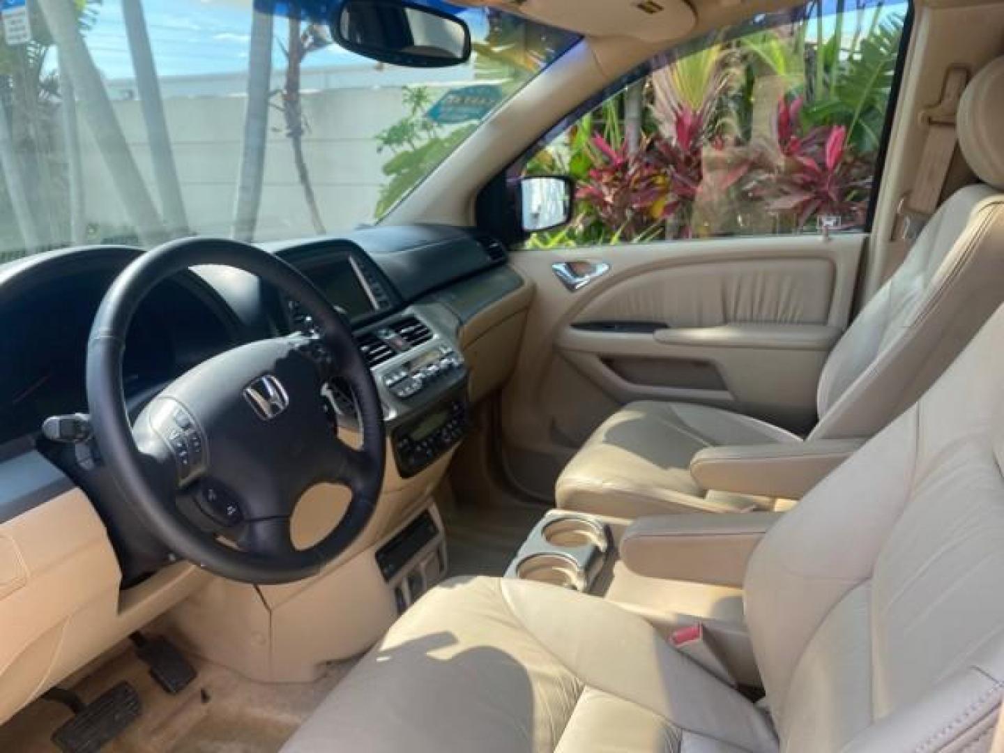 2005 Redrock Pearl /Ivory Honda Odyssey TOURING LOW MILES 62,337 FL (5FNRL38815B) with an 3.5L SOHC MPFI 24-Valve i-VTEC V6 Engine engine, Automatic transmission, located at 4701 North Dixie Hwy, Pompano Beach, FL, 33064, (954) 422-2889, 26.240938, -80.123474 - OUR WEBPAGE FLORIDACARS1.COM HAS OVER 100 PHOTOS AND FREE CARFAX LINK 2005 Honda Odyssey Touring LOADED LEATHER SUNROOF NAVIGATION Van 3.5L V6 F SOHC 24V Gasoline 28 MPG Front Wheel Drive Features ABS Brakes Air Conditioning Alloy Wheels AM/FM Stereo Automatic Transmission Auxiliary Audio Input CD A- Photo#43