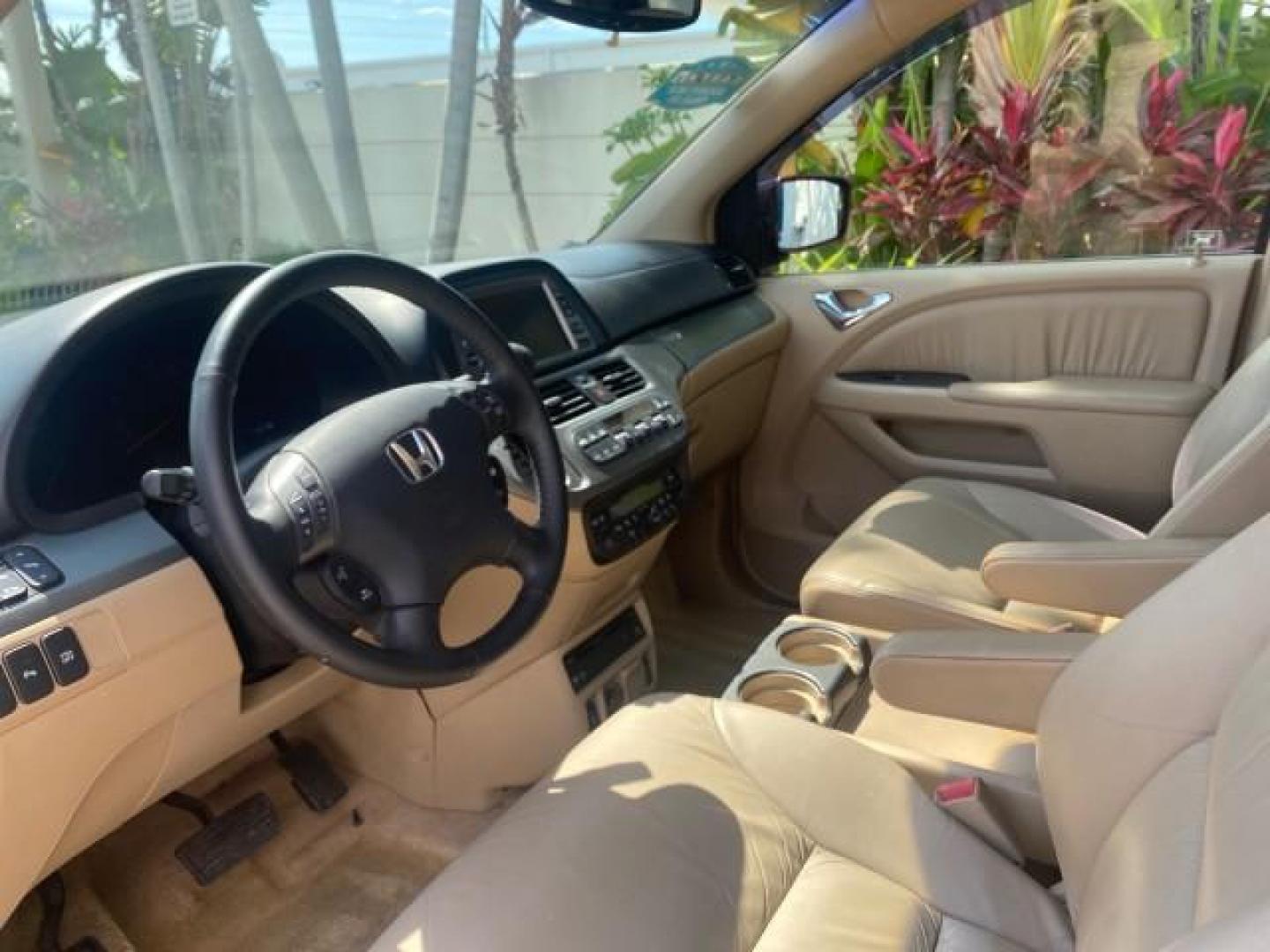 2005 Redrock Pearl /Ivory Honda Odyssey TOURING LOW MILES 62,337 FL (5FNRL38815B) with an 3.5L SOHC MPFI 24-Valve i-VTEC V6 Engine engine, Automatic transmission, located at 4701 North Dixie Hwy, Pompano Beach, FL, 33064, (954) 422-2889, 26.240938, -80.123474 - OUR WEBPAGE FLORIDACARS1.COM HAS OVER 100 PHOTOS AND FREE CARFAX LINK 2005 Honda Odyssey Touring LOADED LEATHER SUNROOF NAVIGATION Van 3.5L V6 F SOHC 24V Gasoline 28 MPG Front Wheel Drive Features ABS Brakes Air Conditioning Alloy Wheels AM/FM Stereo Automatic Transmission Auxiliary Audio Input CD A- Photo#44