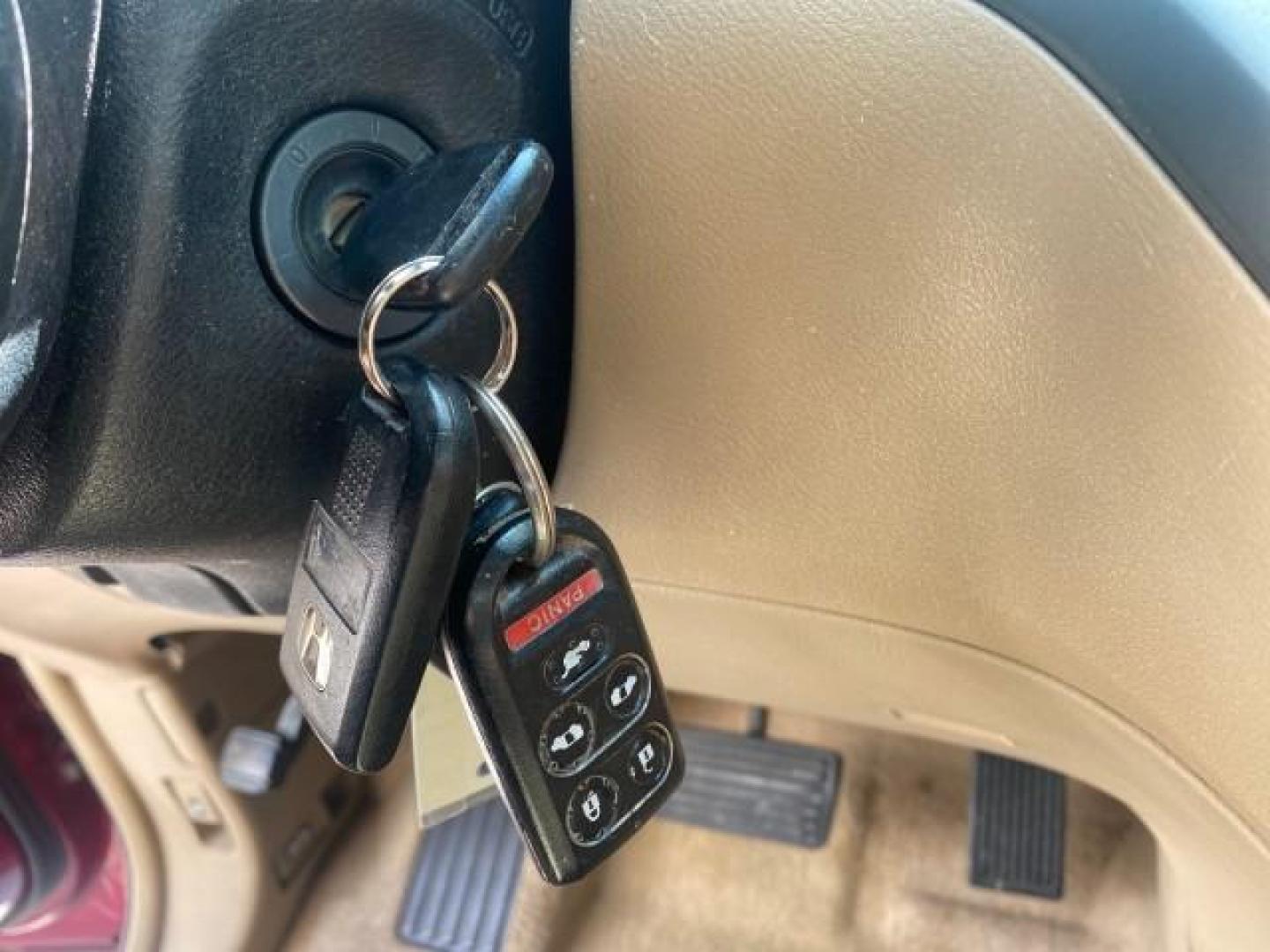 2005 Redrock Pearl /Ivory Honda Odyssey TOURING LOW MILES 62,337 FL (5FNRL38815B) with an 3.5L SOHC MPFI 24-Valve i-VTEC V6 Engine engine, Automatic transmission, located at 4701 North Dixie Hwy, Pompano Beach, FL, 33064, (954) 422-2889, 26.240938, -80.123474 - OUR WEBPAGE FLORIDACARS1.COM HAS OVER 100 PHOTOS AND FREE CARFAX LINK 2005 Honda Odyssey Touring LOADED LEATHER SUNROOF NAVIGATION Van 3.5L V6 F SOHC 24V Gasoline 28 MPG Front Wheel Drive Features ABS Brakes Air Conditioning Alloy Wheels AM/FM Stereo Automatic Transmission Auxiliary Audio Input CD A- Photo#53