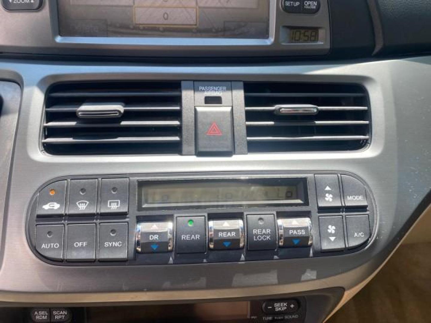 2005 Redrock Pearl /Ivory Honda Odyssey TOURING LOW MILES 62,337 FL (5FNRL38815B) with an 3.5L SOHC MPFI 24-Valve i-VTEC V6 Engine engine, Automatic transmission, located at 4701 North Dixie Hwy, Pompano Beach, FL, 33064, (954) 422-2889, 26.240938, -80.123474 - OUR WEBPAGE FLORIDACARS1.COM HAS OVER 100 PHOTOS AND FREE CARFAX LINK 2005 Honda Odyssey Touring LOADED LEATHER SUNROOF NAVIGATION Van 3.5L V6 F SOHC 24V Gasoline 28 MPG Front Wheel Drive Features ABS Brakes Air Conditioning Alloy Wheels AM/FM Stereo Automatic Transmission Auxiliary Audio Input CD A- Photo#57