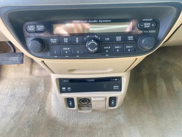 2005 Redrock Pearl /Ivory Honda Odyssey TOURING LOW MILES 62,337 FL (5FNRL38815B) with an 3.5L SOHC MPFI 24-Valve i-VTEC V6 Engine engine, Automatic transmission, located at 4701 North Dixie Hwy, Pompano Beach, FL, 33064, (954) 422-2889, 26.240938, -80.123474 - OUR WEBPAGE FLORIDACARS1.COM HAS OVER 100 PHOTOS AND FREE CARFAX LINK 2005 Honda Odyssey Touring LOADED LEATHER SUNROOF NAVIGATION Van 3.5L V6 F SOHC 24V Gasoline 28 MPG Front Wheel Drive Features ABS Brakes Air Conditioning Alloy Wheels AM/FM Stereo Automatic Transmission Auxiliary Audio Input CD A - Photo#58