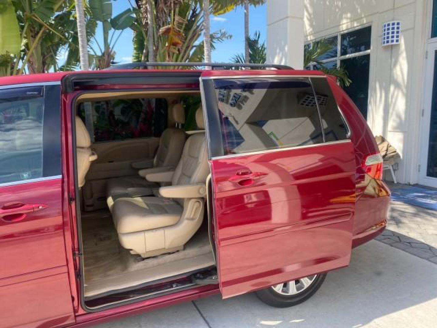 2005 Redrock Pearl /Ivory Honda Odyssey TOURING LOW MILES 62,337 FL (5FNRL38815B) with an 3.5L SOHC MPFI 24-Valve i-VTEC V6 Engine engine, Automatic transmission, located at 4701 North Dixie Hwy, Pompano Beach, FL, 33064, (954) 422-2889, 26.240938, -80.123474 - OUR WEBPAGE FLORIDACARS1.COM HAS OVER 100 PHOTOS AND FREE CARFAX LINK 2005 Honda Odyssey Touring LOADED LEATHER SUNROOF NAVIGATION Van 3.5L V6 F SOHC 24V Gasoline 28 MPG Front Wheel Drive Features ABS Brakes Air Conditioning Alloy Wheels AM/FM Stereo Automatic Transmission Auxiliary Audio Input CD A- Photo#74