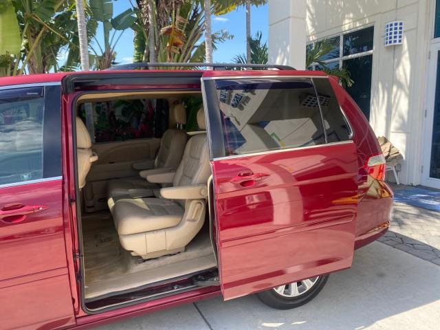 2005 Redrock Pearl /Ivory Honda Odyssey TOURING LOW MILES 62,337 FL (5FNRL38815B) with an 3.5L SOHC MPFI 24-Valve i-VTEC V6 Engine engine, Automatic transmission, located at 4701 North Dixie Hwy, Pompano Beach, FL, 33064, (954) 422-2889, 26.240938, -80.123474 - OUR WEBPAGE FLORIDACARS1.COM HAS OVER 100 PHOTOS AND FREE CARFAX LINK 2005 Honda Odyssey Touring LOADED LEATHER SUNROOF NAVIGATION Van 3.5L V6 F SOHC 24V Gasoline 28 MPG Front Wheel Drive Features ABS Brakes Air Conditioning Alloy Wheels AM/FM Stereo Automatic Transmission Auxiliary Audio Input CD A - Photo#74