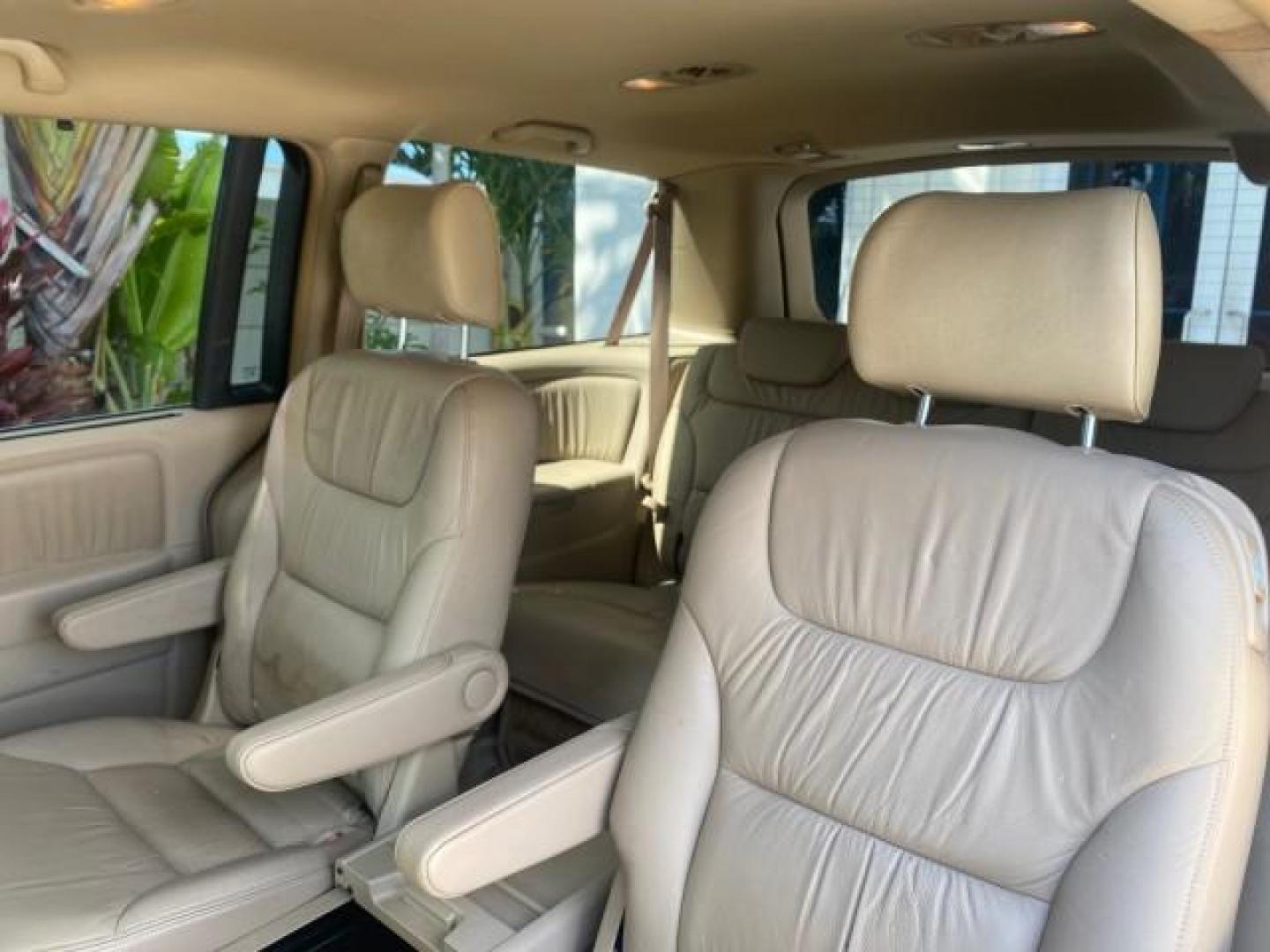2005 Redrock Pearl /Ivory Honda Odyssey TOURING LOW MILES 62,337 FL (5FNRL38815B) with an 3.5L SOHC MPFI 24-Valve i-VTEC V6 Engine engine, Automatic transmission, located at 4701 North Dixie Hwy, Pompano Beach, FL, 33064, (954) 422-2889, 26.240938, -80.123474 - OUR WEBPAGE FLORIDACARS1.COM HAS OVER 100 PHOTOS AND FREE CARFAX LINK 2005 Honda Odyssey Touring LOADED LEATHER SUNROOF NAVIGATION Van 3.5L V6 F SOHC 24V Gasoline 28 MPG Front Wheel Drive Features ABS Brakes Air Conditioning Alloy Wheels AM/FM Stereo Automatic Transmission Auxiliary Audio Input CD A- Photo#77