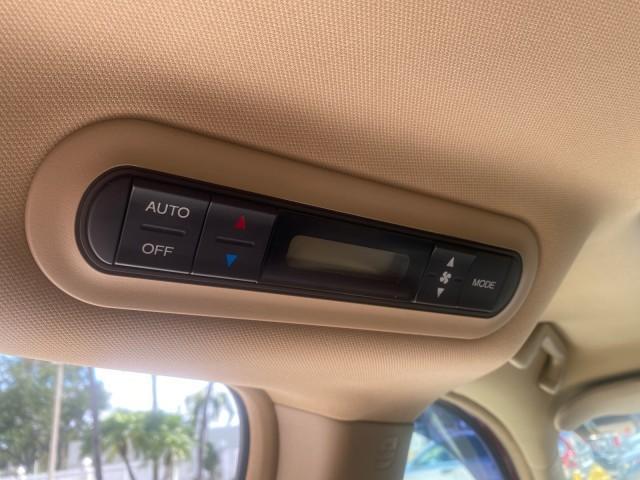 2005 Redrock Pearl /Ivory Honda Odyssey TOURING LOW MILES 62,337 FL (5FNRL38815B) with an 3.5L SOHC MPFI 24-Valve i-VTEC V6 Engine engine, Automatic transmission, located at 4701 North Dixie Hwy, Pompano Beach, FL, 33064, (954) 422-2889, 26.240938, -80.123474 - OUR WEBPAGE FLORIDACARS1.COM HAS OVER 100 PHOTOS AND FREE CARFAX LINK 2005 Honda Odyssey Touring LOADED LEATHER SUNROOF NAVIGATION Van 3.5L V6 F SOHC 24V Gasoline 28 MPG Front Wheel Drive Features ABS Brakes Air Conditioning Alloy Wheels AM/FM Stereo Automatic Transmission Auxiliary Audio Input CD A - Photo#81