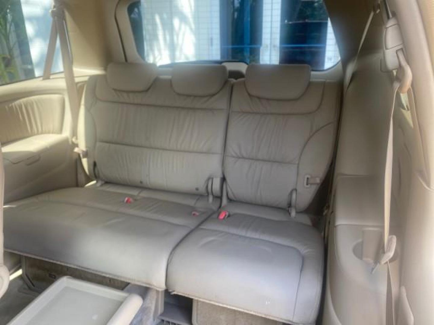 2005 Redrock Pearl /Ivory Honda Odyssey TOURING LOW MILES 62,337 FL (5FNRL38815B) with an 3.5L SOHC MPFI 24-Valve i-VTEC V6 Engine engine, Automatic transmission, located at 4701 North Dixie Hwy, Pompano Beach, FL, 33064, (954) 422-2889, 26.240938, -80.123474 - OUR WEBPAGE FLORIDACARS1.COM HAS OVER 100 PHOTOS AND FREE CARFAX LINK 2005 Honda Odyssey Touring LOADED LEATHER SUNROOF NAVIGATION Van 3.5L V6 F SOHC 24V Gasoline 28 MPG Front Wheel Drive Features ABS Brakes Air Conditioning Alloy Wheels AM/FM Stereo Automatic Transmission Auxiliary Audio Input CD A- Photo#89