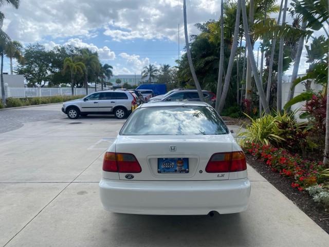 2000 Taffeta White /Gray Honda Civic LX LOW MILES 31,619 1 OWNER (2HGEJ667XYH) with an 1.6L SOHC 16-Valve I4 Engine engine, Automatic transmission, located at 4701 North Dixie Hwy, Pompano Beach, FL, 33064, (954) 422-2889, 26.240938, -80.123474 - OUR WEBPAGE FLORIDACARS1.COM HAS OVER 100 PHOTOS AND FREE CARFAX LINK 2000 Honda Civic LX 1 OWNER Sedan 4 DR 1.6L I4 F SOHC 16V Gasoline 36 MPG Front Wheel Drive Features ABS Brakes Air Conditioning AM/FM Stereo Automatic Transmission Cloth Seats Cruise Control Power Locks Power Mirrors Power Window - Photo#34
