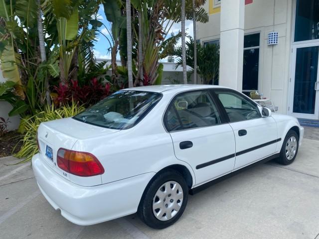 2000 Taffeta White /Gray Honda Civic LX LOW MILES 31,619 1 OWNER (2HGEJ667XYH) with an 1.6L SOHC 16-Valve I4 Engine engine, Automatic transmission, located at 4701 North Dixie Hwy, Pompano Beach, FL, 33064, (954) 422-2889, 26.240938, -80.123474 - OUR WEBPAGE FLORIDACARS1.COM HAS OVER 100 PHOTOS AND FREE CARFAX LINK 2000 Honda Civic LX 1 OWNER Sedan 4 DR 1.6L I4 F SOHC 16V Gasoline 36 MPG Front Wheel Drive Features ABS Brakes Air Conditioning AM/FM Stereo Automatic Transmission Cloth Seats Cruise Control Power Locks Power Mirrors Power Window - Photo#86