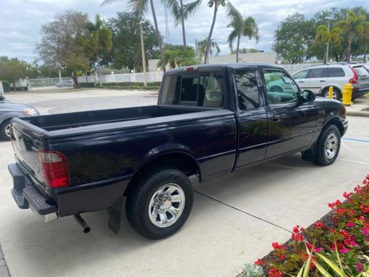 2003 Deep Wedgewood Blue Metallic /Dark Graphite Ford Ranger XLT AUTO X CAB LOW MILES 76,750 (1FTYR44V53P) with an 3.0L SEFI Flex-Fuel FFV V6 Engine engine, Automatic transmission, located at 4701 North Dixie Hwy, Pompano Beach, FL, 33064, (954) 422-2889, 26.240938, -80.123474 - OUR WEBPAGE FLORIDACARS1.COM HAS OVER 100 PHOTOS AND FREE CARFAX LINK 2003 Ford Ranger XLT AUTO AC LOADED GOOD FOR POOL SERVICE OR DELIEVERY SERVICE VERY DEPENDABLE 4 Door Extended Cab Pickup 3.0L V6 F Flex Fuel 23 MPG Rear Wheel Drive Features ABS Brakes Air Conditioning AM/FM Stereo Automatic Tran- Photo#7