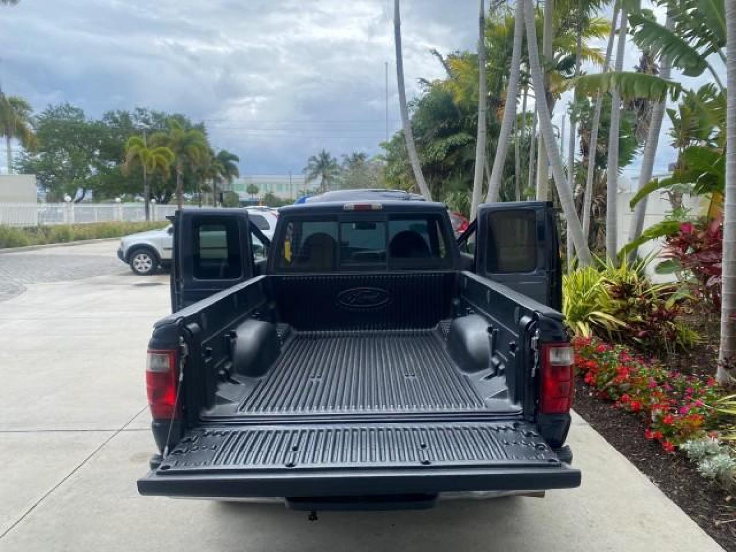 2003 Deep Wedgewood Blue Metallic /Dark Graphite Ford Ranger XLT AUTO X CAB LOW MILES 76,750 (1FTYR44V53P) with an 3.0L SEFI Flex-Fuel FFV V6 Engine engine, Automatic transmission, located at 4701 North Dixie Hwy, Pompano Beach, FL, 33064, (954) 422-2889, 26.240938, -80.123474 - OUR WEBPAGE FLORIDACARS1.COM HAS OVER 100 PHOTOS AND FREE CARFAX LINK 2003 Ford Ranger XLT AUTO AC LOADED GOOD FOR POOL SERVICE OR DELIEVERY SERVICE VERY DEPENDABLE 4 Door Extended Cab Pickup 3.0L V6 F Flex Fuel 23 MPG Rear Wheel Drive Features ABS Brakes Air Conditioning AM/FM Stereo Automatic Tran- Photo#15