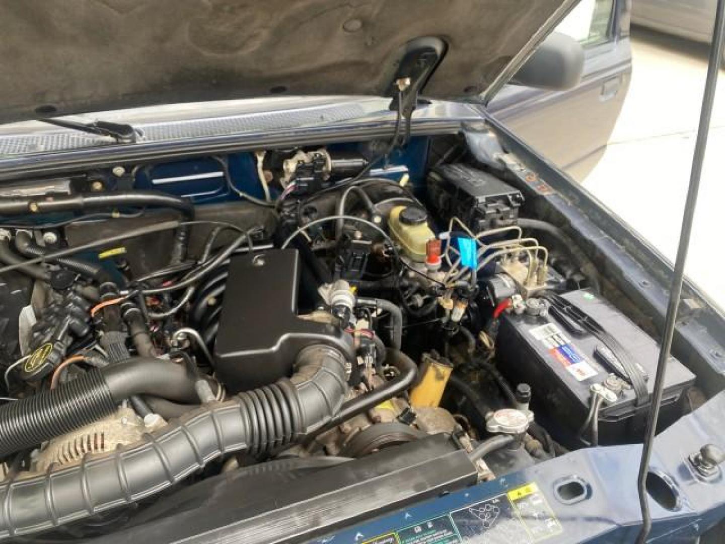 2003 Deep Wedgewood Blue Metallic /Dark Graphite Ford Ranger XLT AUTO X CAB LOW MILES 76,750 (1FTYR44V53P) with an 3.0L SEFI Flex-Fuel FFV V6 Engine engine, Automatic transmission, located at 4701 North Dixie Hwy, Pompano Beach, FL, 33064, (954) 422-2889, 26.240938, -80.123474 - OUR WEBPAGE FLORIDACARS1.COM HAS OVER 100 PHOTOS AND FREE CARFAX LINK 2003 Ford Ranger XLT AUTO AC LOADED GOOD FOR POOL SERVICE OR DELIEVERY SERVICE VERY DEPENDABLE 4 Door Extended Cab Pickup 3.0L V6 F Flex Fuel 23 MPG Rear Wheel Drive Features ABS Brakes Air Conditioning AM/FM Stereo Automatic Tran- Photo#25