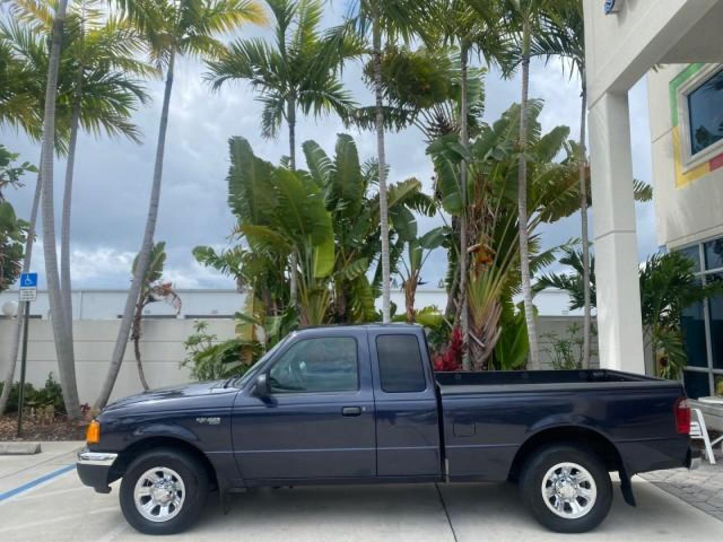 2003 Deep Wedgewood Blue Metallic /Dark Graphite Ford Ranger XLT AUTO X CAB LOW MILES 76,750 (1FTYR44V53P) with an 3.0L SEFI Flex-Fuel FFV V6 Engine engine, Automatic transmission, located at 4701 North Dixie Hwy, Pompano Beach, FL, 33064, (954) 422-2889, 26.240938, -80.123474 - OUR WEBPAGE FLORIDACARS1.COM HAS OVER 100 PHOTOS AND FREE CARFAX LINK 2003 Ford Ranger XLT AUTO AC LOADED GOOD FOR POOL SERVICE OR DELIEVERY SERVICE VERY DEPENDABLE 4 Door Extended Cab Pickup 3.0L V6 F Flex Fuel 23 MPG Rear Wheel Drive Features ABS Brakes Air Conditioning AM/FM Stereo Automatic Tran- Photo#30