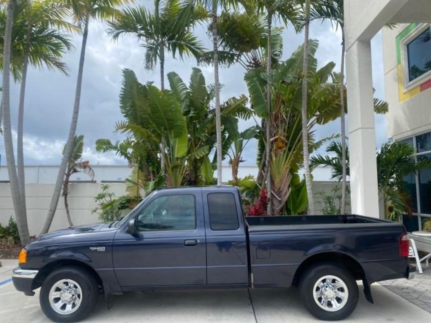 2003 Deep Wedgewood Blue Metallic /Dark Graphite Ford Ranger XLT AUTO X CAB LOW MILES 76,750 (1FTYR44V53P) with an 3.0L SEFI Flex-Fuel FFV V6 Engine engine, Automatic transmission, located at 4701 North Dixie Hwy, Pompano Beach, FL, 33064, (954) 422-2889, 26.240938, -80.123474 - OUR WEBPAGE FLORIDACARS1.COM HAS OVER 100 PHOTOS AND FREE CARFAX LINK 2003 Ford Ranger XLT AUTO AC LOADED GOOD FOR POOL SERVICE OR DELIEVERY SERVICE VERY DEPENDABLE 4 Door Extended Cab Pickup 3.0L V6 F Flex Fuel 23 MPG Rear Wheel Drive Features ABS Brakes Air Conditioning AM/FM Stereo Automatic Tran- Photo#31