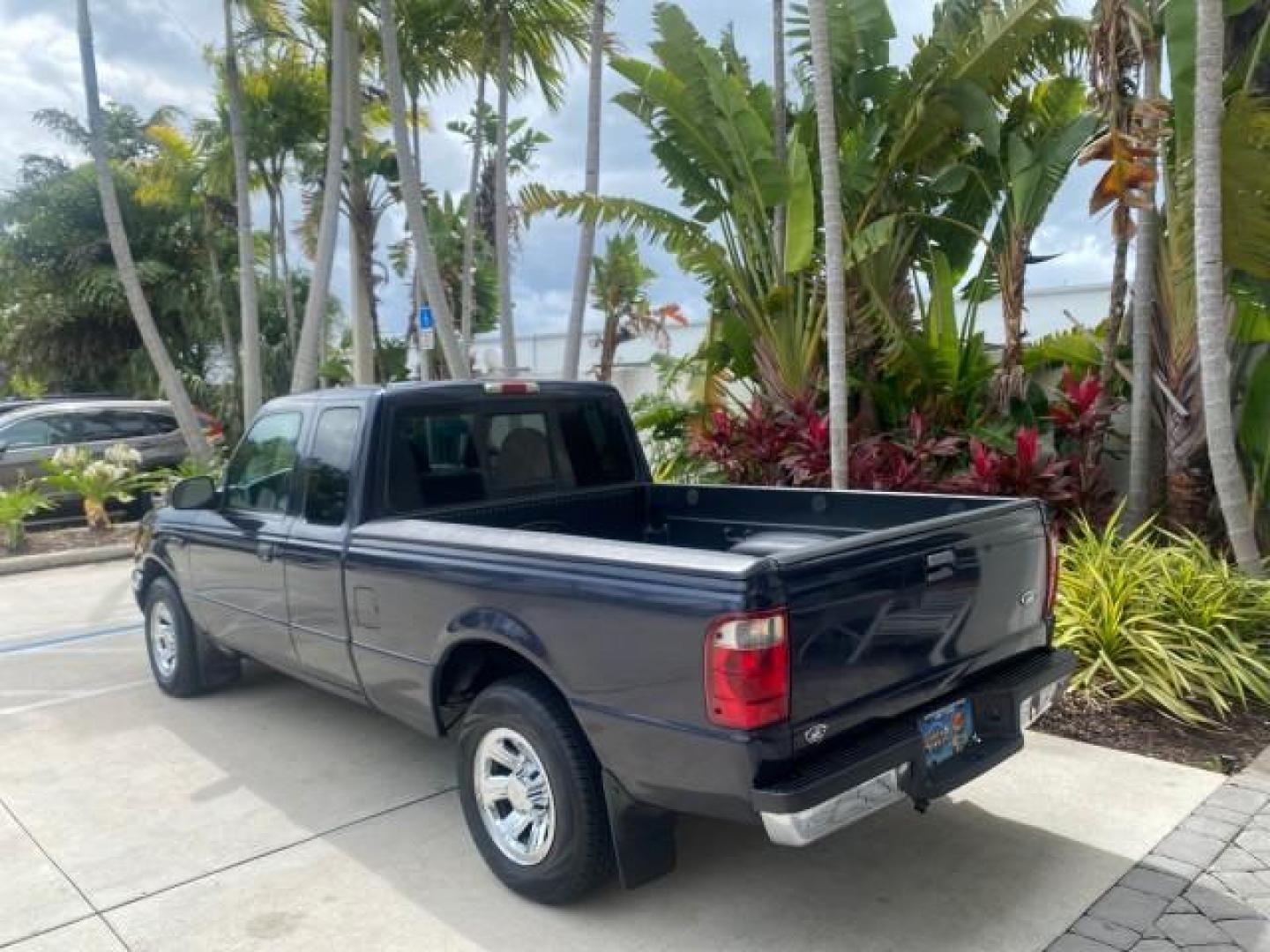 2003 Deep Wedgewood Blue Metallic /Dark Graphite Ford Ranger XLT AUTO X CAB LOW MILES 76,750 (1FTYR44V53P) with an 3.0L SEFI Flex-Fuel FFV V6 Engine engine, Automatic transmission, located at 4701 North Dixie Hwy, Pompano Beach, FL, 33064, (954) 422-2889, 26.240938, -80.123474 - OUR WEBPAGE FLORIDACARS1.COM HAS OVER 100 PHOTOS AND FREE CARFAX LINK 2003 Ford Ranger XLT AUTO AC LOADED GOOD FOR POOL SERVICE OR DELIEVERY SERVICE VERY DEPENDABLE 4 Door Extended Cab Pickup 3.0L V6 F Flex Fuel 23 MPG Rear Wheel Drive Features ABS Brakes Air Conditioning AM/FM Stereo Automatic Tran- Photo#32