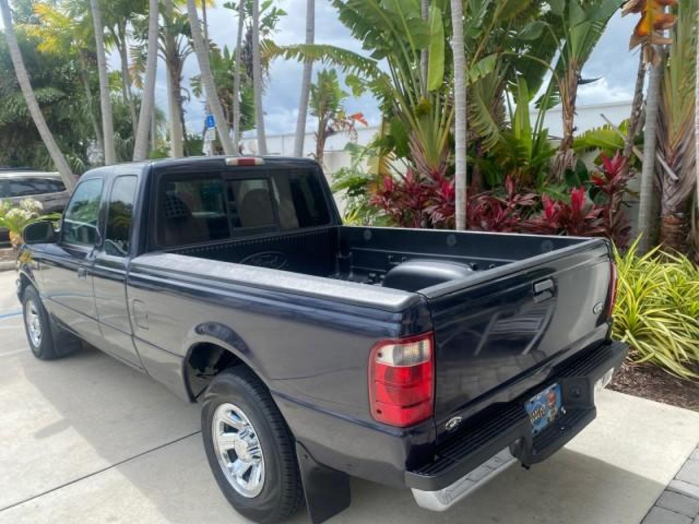 2003 Deep Wedgewood Blue Metallic /Dark Graphite Ford Ranger XLT AUTO X CAB LOW MILES 76,750 (1FTYR44V53P) with an 3.0L SEFI Flex-Fuel FFV V6 Engine engine, Automatic transmission, located at 4701 North Dixie Hwy, Pompano Beach, FL, 33064, (954) 422-2889, 26.240938, -80.123474 - OUR WEBPAGE FLORIDACARS1.COM HAS OVER 100 PHOTOS AND FREE CARFAX LINK 2003 Ford Ranger XLT AUTO AC LOADED GOOD FOR POOL SERVICE OR DELIEVERY SERVICE VERY DEPENDABLE 4 Door Extended Cab Pickup 3.0L V6 F Flex Fuel 23 MPG Rear Wheel Drive Features ABS Brakes Air Conditioning AM/FM Stereo Automatic Tran- Photo#33