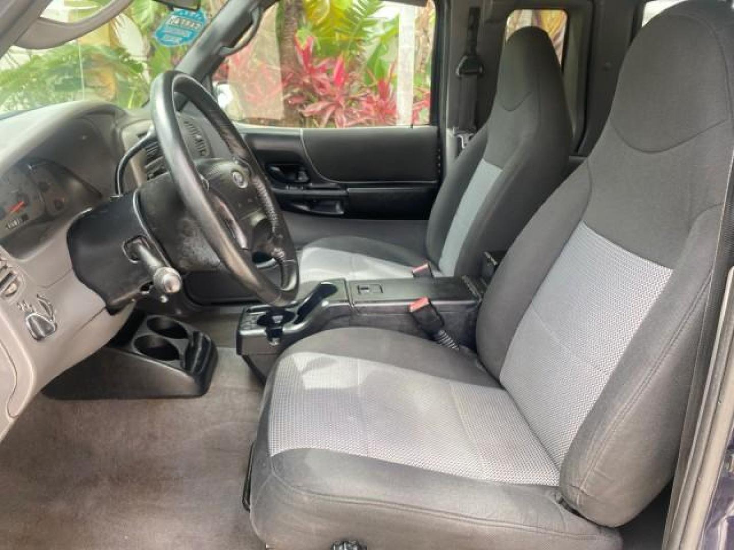 2003 Deep Wedgewood Blue Metallic /Dark Graphite Ford Ranger XLT AUTO X CAB LOW MILES 76,750 (1FTYR44V53P) with an 3.0L SEFI Flex-Fuel FFV V6 Engine engine, Automatic transmission, located at 4701 North Dixie Hwy, Pompano Beach, FL, 33064, (954) 422-2889, 26.240938, -80.123474 - OUR WEBPAGE FLORIDACARS1.COM HAS OVER 100 PHOTOS AND FREE CARFAX LINK 2003 Ford Ranger XLT AUTO AC LOADED GOOD FOR POOL SERVICE OR DELIEVERY SERVICE VERY DEPENDABLE 4 Door Extended Cab Pickup 3.0L V6 F Flex Fuel 23 MPG Rear Wheel Drive Features ABS Brakes Air Conditioning AM/FM Stereo Automatic Tran- Photo#44