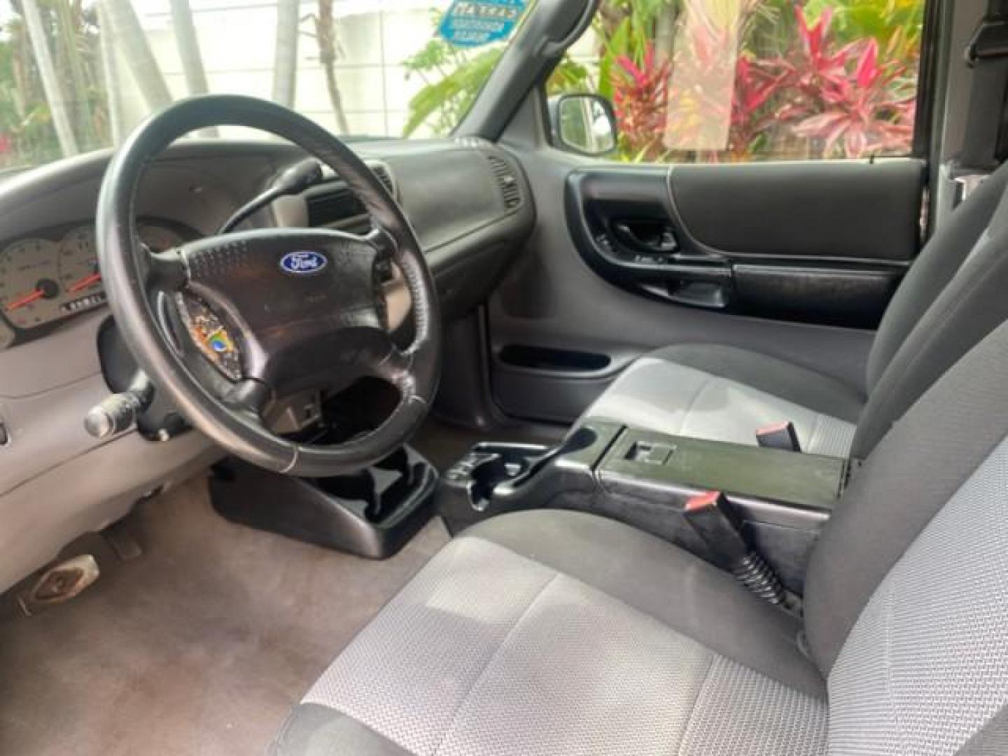 2003 Deep Wedgewood Blue Metallic /Dark Graphite Ford Ranger XLT AUTO X CAB LOW MILES 76,750 (1FTYR44V53P) with an 3.0L SEFI Flex-Fuel FFV V6 Engine engine, Automatic transmission, located at 4701 North Dixie Hwy, Pompano Beach, FL, 33064, (954) 422-2889, 26.240938, -80.123474 - OUR WEBPAGE FLORIDACARS1.COM HAS OVER 100 PHOTOS AND FREE CARFAX LINK 2003 Ford Ranger XLT AUTO AC LOADED GOOD FOR POOL SERVICE OR DELIEVERY SERVICE VERY DEPENDABLE 4 Door Extended Cab Pickup 3.0L V6 F Flex Fuel 23 MPG Rear Wheel Drive Features ABS Brakes Air Conditioning AM/FM Stereo Automatic Tran- Photo#46