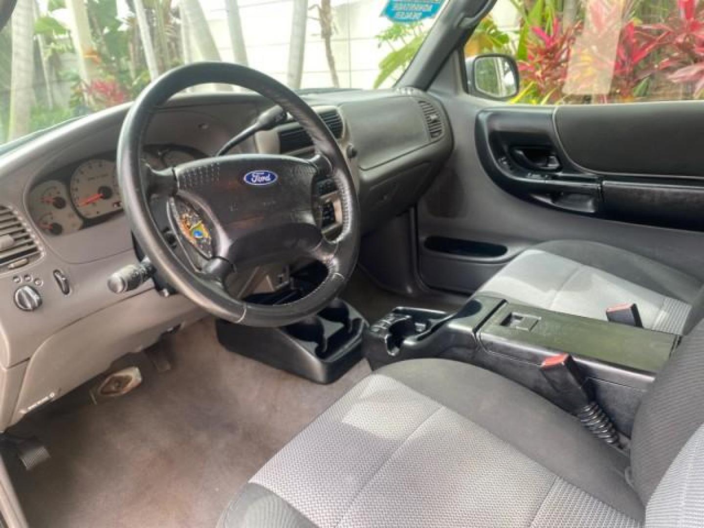 2003 Deep Wedgewood Blue Metallic /Dark Graphite Ford Ranger XLT AUTO X CAB LOW MILES 76,750 (1FTYR44V53P) with an 3.0L SEFI Flex-Fuel FFV V6 Engine engine, Automatic transmission, located at 4701 North Dixie Hwy, Pompano Beach, FL, 33064, (954) 422-2889, 26.240938, -80.123474 - OUR WEBPAGE FLORIDACARS1.COM HAS OVER 100 PHOTOS AND FREE CARFAX LINK 2003 Ford Ranger XLT AUTO AC LOADED GOOD FOR POOL SERVICE OR DELIEVERY SERVICE VERY DEPENDABLE 4 Door Extended Cab Pickup 3.0L V6 F Flex Fuel 23 MPG Rear Wheel Drive Features ABS Brakes Air Conditioning AM/FM Stereo Automatic Tran- Photo#47