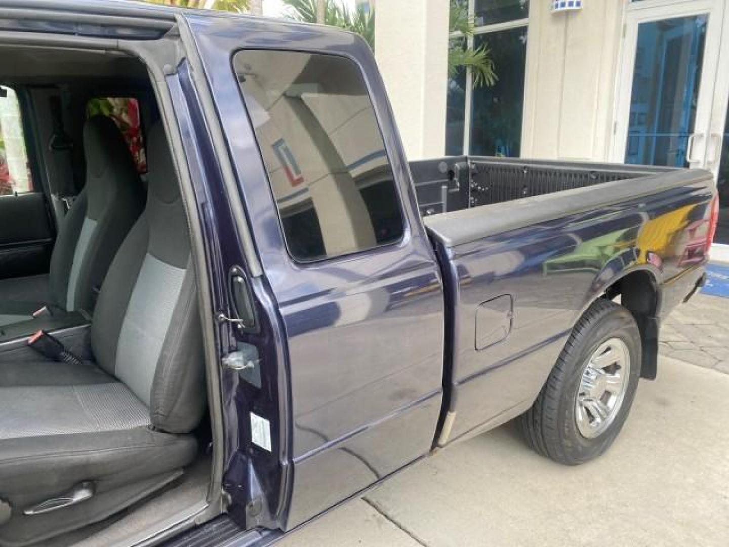 2003 Deep Wedgewood Blue Metallic /Dark Graphite Ford Ranger XLT AUTO X CAB LOW MILES 76,750 (1FTYR44V53P) with an 3.0L SEFI Flex-Fuel FFV V6 Engine engine, Automatic transmission, located at 4701 North Dixie Hwy, Pompano Beach, FL, 33064, (954) 422-2889, 26.240938, -80.123474 - OUR WEBPAGE FLORIDACARS1.COM HAS OVER 100 PHOTOS AND FREE CARFAX LINK 2003 Ford Ranger XLT AUTO AC LOADED GOOD FOR POOL SERVICE OR DELIEVERY SERVICE VERY DEPENDABLE 4 Door Extended Cab Pickup 3.0L V6 F Flex Fuel 23 MPG Rear Wheel Drive Features ABS Brakes Air Conditioning AM/FM Stereo Automatic Tran- Photo#71