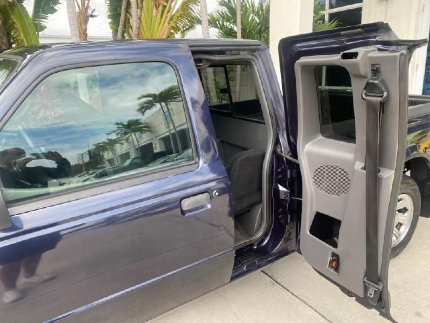 2003 Deep Wedgewood Blue Metallic /Dark Graphite Ford Ranger XLT AUTO X CAB LOW MILES 76,750 (1FTYR44V53P) with an 3.0L SEFI Flex-Fuel FFV V6 Engine engine, Automatic transmission, located at 4701 North Dixie Hwy, Pompano Beach, FL, 33064, (954) 422-2889, 26.240938, -80.123474 - OUR WEBPAGE FLORIDACARS1.COM HAS OVER 100 PHOTOS AND FREE CARFAX LINK 2003 Ford Ranger XLT AUTO AC LOADED GOOD FOR POOL SERVICE OR DELIEVERY SERVICE VERY DEPENDABLE 4 Door Extended Cab Pickup 3.0L V6 F Flex Fuel 23 MPG Rear Wheel Drive Features ABS Brakes Air Conditioning AM/FM Stereo Automatic Tran- Photo#72