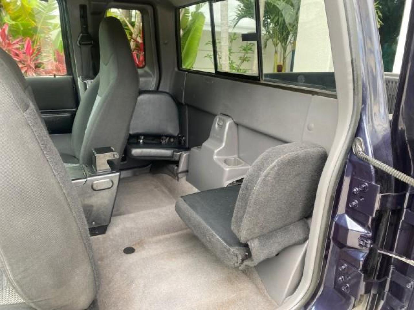 2003 Deep Wedgewood Blue Metallic /Dark Graphite Ford Ranger XLT AUTO X CAB LOW MILES 76,750 (1FTYR44V53P) with an 3.0L SEFI Flex-Fuel FFV V6 Engine engine, Automatic transmission, located at 4701 North Dixie Hwy, Pompano Beach, FL, 33064, (954) 422-2889, 26.240938, -80.123474 - OUR WEBPAGE FLORIDACARS1.COM HAS OVER 100 PHOTOS AND FREE CARFAX LINK 2003 Ford Ranger XLT AUTO AC LOADED GOOD FOR POOL SERVICE OR DELIEVERY SERVICE VERY DEPENDABLE 4 Door Extended Cab Pickup 3.0L V6 F Flex Fuel 23 MPG Rear Wheel Drive Features ABS Brakes Air Conditioning AM/FM Stereo Automatic Tran- Photo#73