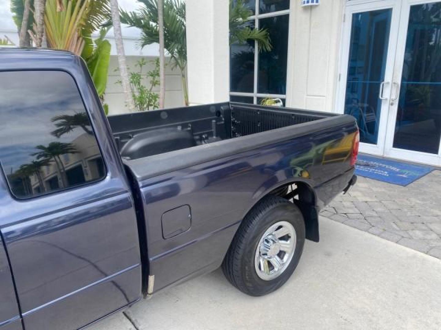 2003 Deep Wedgewood Blue Metallic /Dark Graphite Ford Ranger XLT AUTO X CAB LOW MILES 76,750 (1FTYR44V53P) with an 3.0L SEFI Flex-Fuel FFV V6 Engine engine, Automatic transmission, located at 4701 North Dixie Hwy, Pompano Beach, FL, 33064, (954) 422-2889, 26.240938, -80.123474 - OUR WEBPAGE FLORIDACARS1.COM HAS OVER 100 PHOTOS AND FREE CARFAX LINK 2003 Ford Ranger XLT AUTO AC LOADED GOOD FOR POOL SERVICE OR DELIEVERY SERVICE VERY DEPENDABLE 4 Door Extended Cab Pickup 3.0L V6 F Flex Fuel 23 MPG Rear Wheel Drive Features ABS Brakes Air Conditioning AM/FM Stereo Automatic Tran- Photo#78