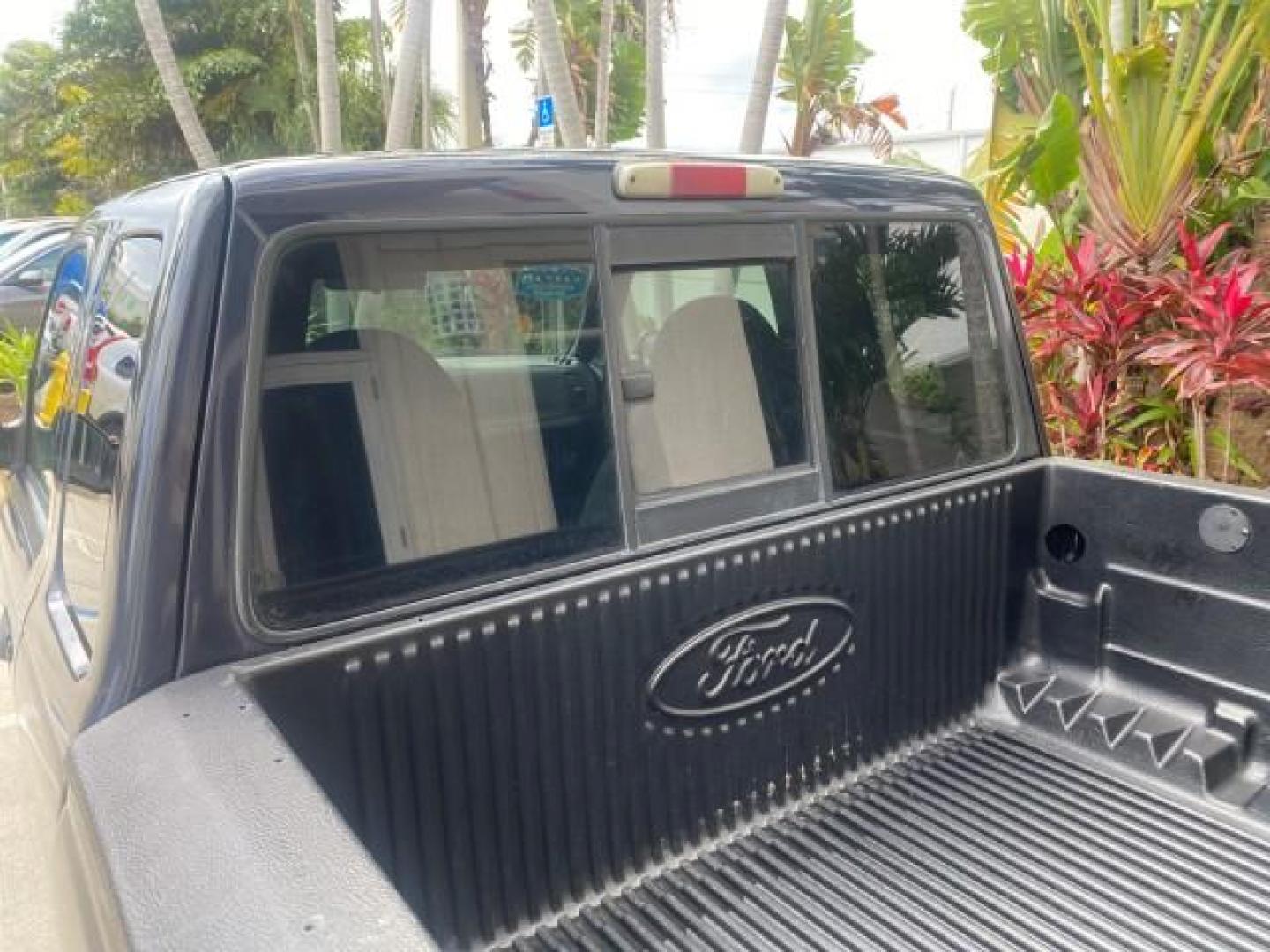 2003 Deep Wedgewood Blue Metallic /Dark Graphite Ford Ranger XLT AUTO X CAB LOW MILES 76,750 (1FTYR44V53P) with an 3.0L SEFI Flex-Fuel FFV V6 Engine engine, Automatic transmission, located at 4701 North Dixie Hwy, Pompano Beach, FL, 33064, (954) 422-2889, 26.240938, -80.123474 - OUR WEBPAGE FLORIDACARS1.COM HAS OVER 100 PHOTOS AND FREE CARFAX LINK 2003 Ford Ranger XLT AUTO AC LOADED GOOD FOR POOL SERVICE OR DELIEVERY SERVICE VERY DEPENDABLE 4 Door Extended Cab Pickup 3.0L V6 F Flex Fuel 23 MPG Rear Wheel Drive Features ABS Brakes Air Conditioning AM/FM Stereo Automatic Tran- Photo#82