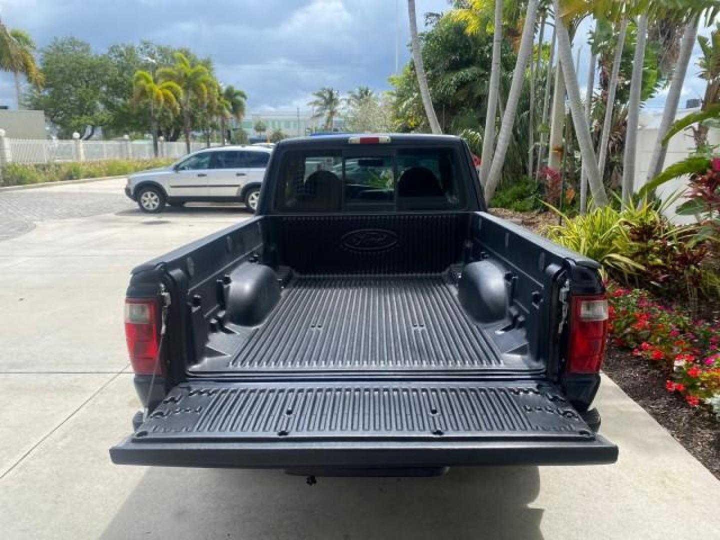2003 Deep Wedgewood Blue Metallic /Dark Graphite Ford Ranger XLT AUTO X CAB LOW MILES 76,750 (1FTYR44V53P) with an 3.0L SEFI Flex-Fuel FFV V6 Engine engine, Automatic transmission, located at 4701 North Dixie Hwy, Pompano Beach, FL, 33064, (954) 422-2889, 26.240938, -80.123474 - OUR WEBPAGE FLORIDACARS1.COM HAS OVER 100 PHOTOS AND FREE CARFAX LINK 2003 Ford Ranger XLT AUTO AC LOADED GOOD FOR POOL SERVICE OR DELIEVERY SERVICE VERY DEPENDABLE 4 Door Extended Cab Pickup 3.0L V6 F Flex Fuel 23 MPG Rear Wheel Drive Features ABS Brakes Air Conditioning AM/FM Stereo Automatic Tran- Photo#97